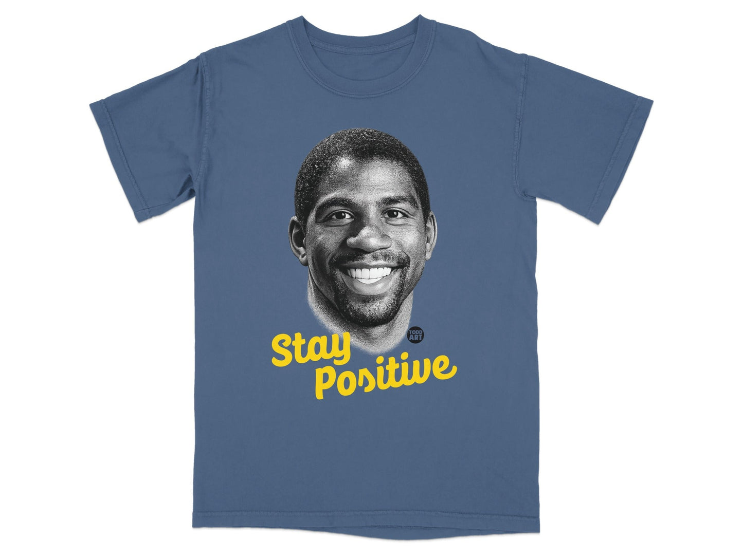 Magic Johnson smiling on a blue t-shirt with "Stay Positive" text.