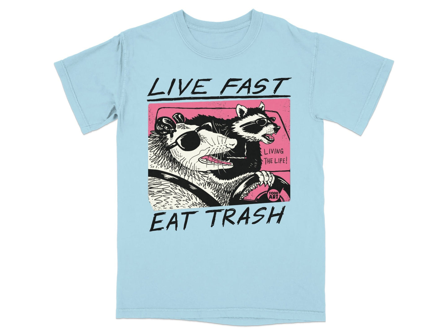 Light blue t-shirt with graphic of a possum and raccoon driving a car.