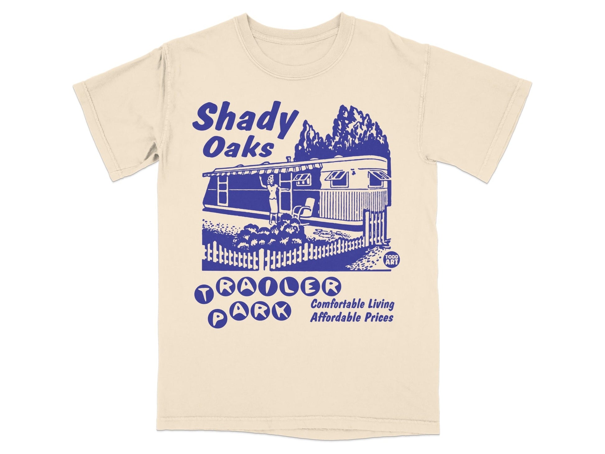 Shady Oaks Trailer Park text and illustration on a beige t-shirt.