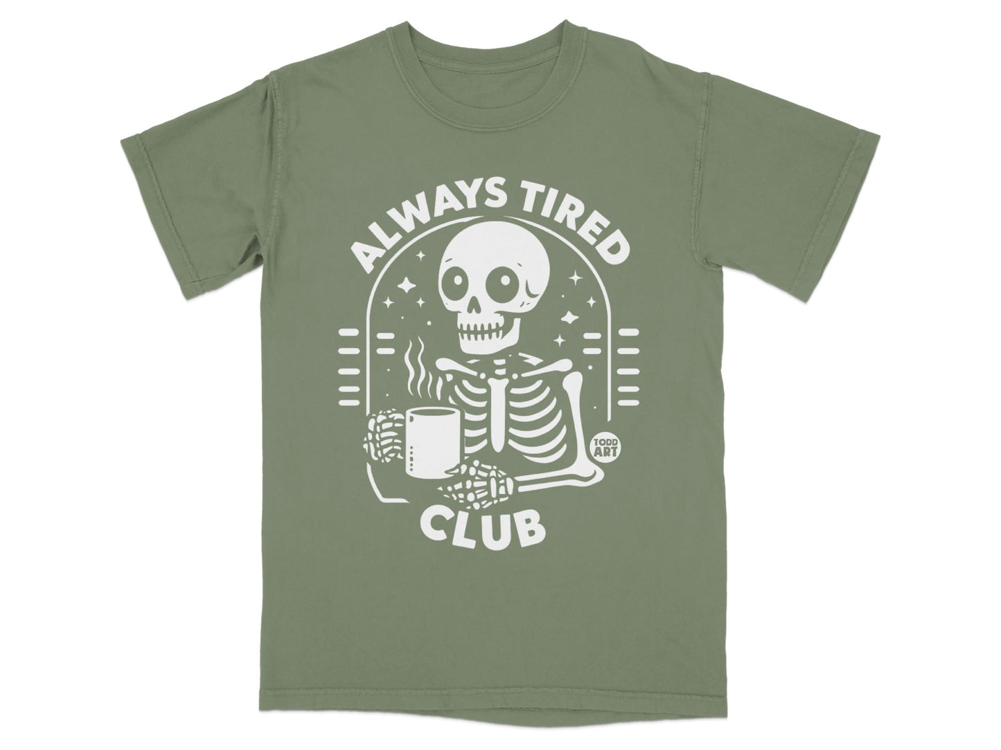 Olive green t-shirt with a white skeleton graphic and "ALWAYS TIRED CLUB" text.