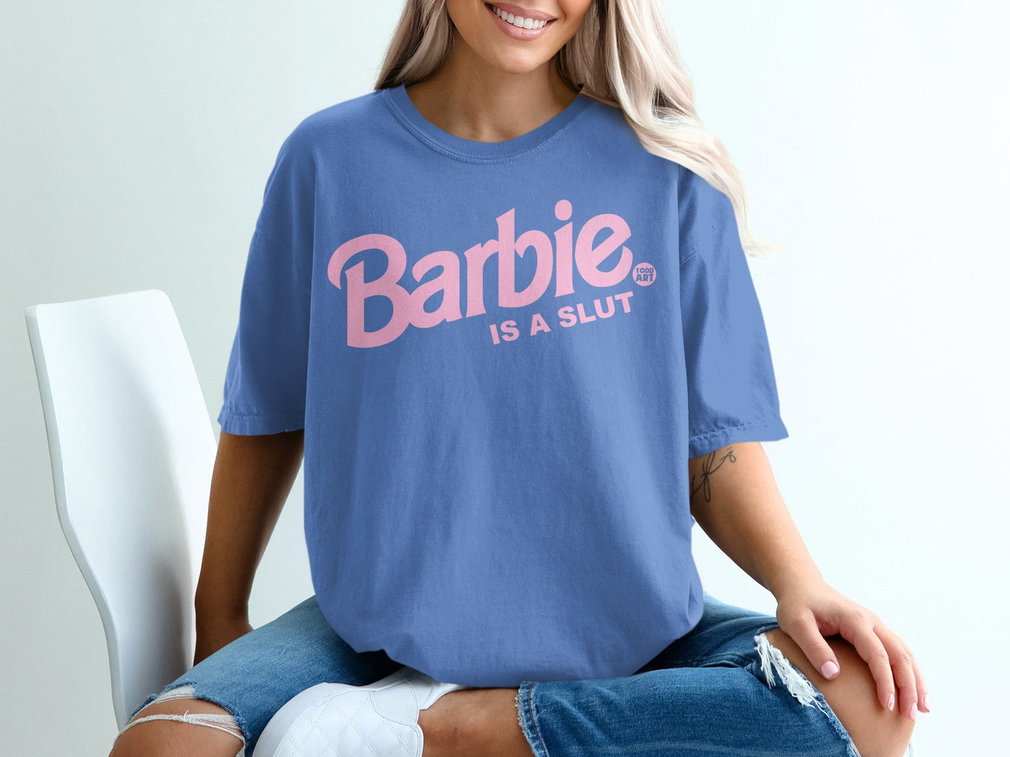 Blue t-shirt with pink "Barbie is a SLUT" text.