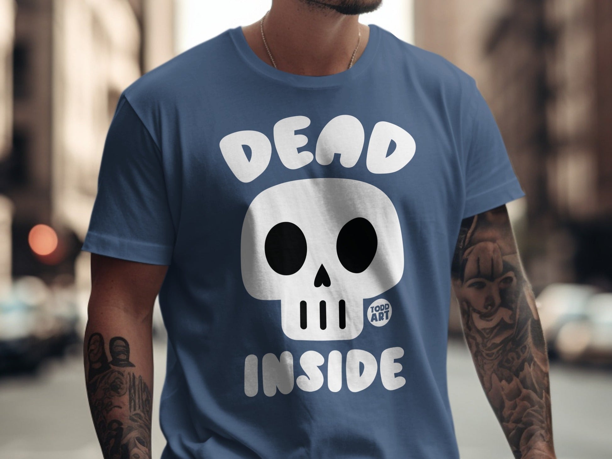 Blue t-shirt with "DEAD INSIDE" text and a white skull logo.