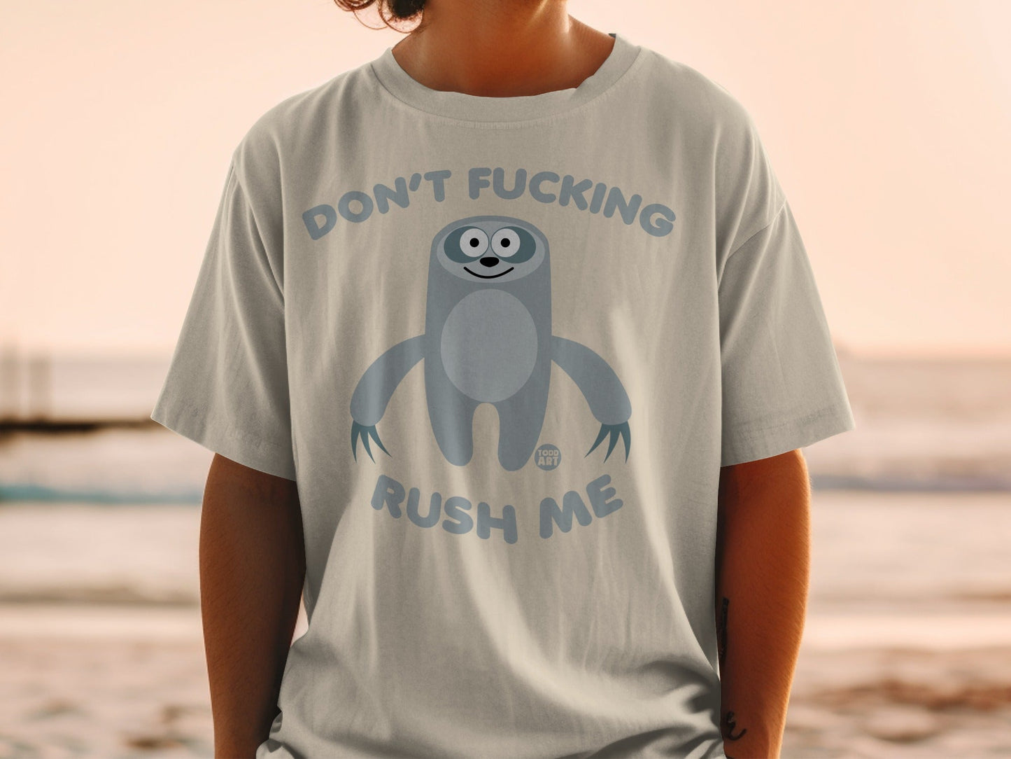 T-shirt with a cartoon sloth and the text "Don't Fucking Rush Me".