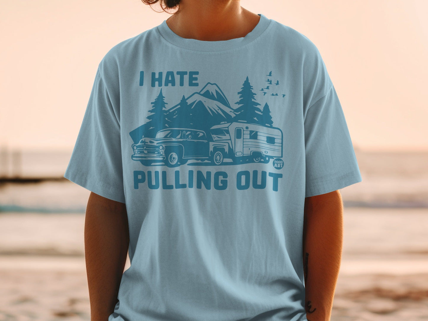 Light blue t-shirt with "I HATE PULLING OUT" text and retro camper scene.