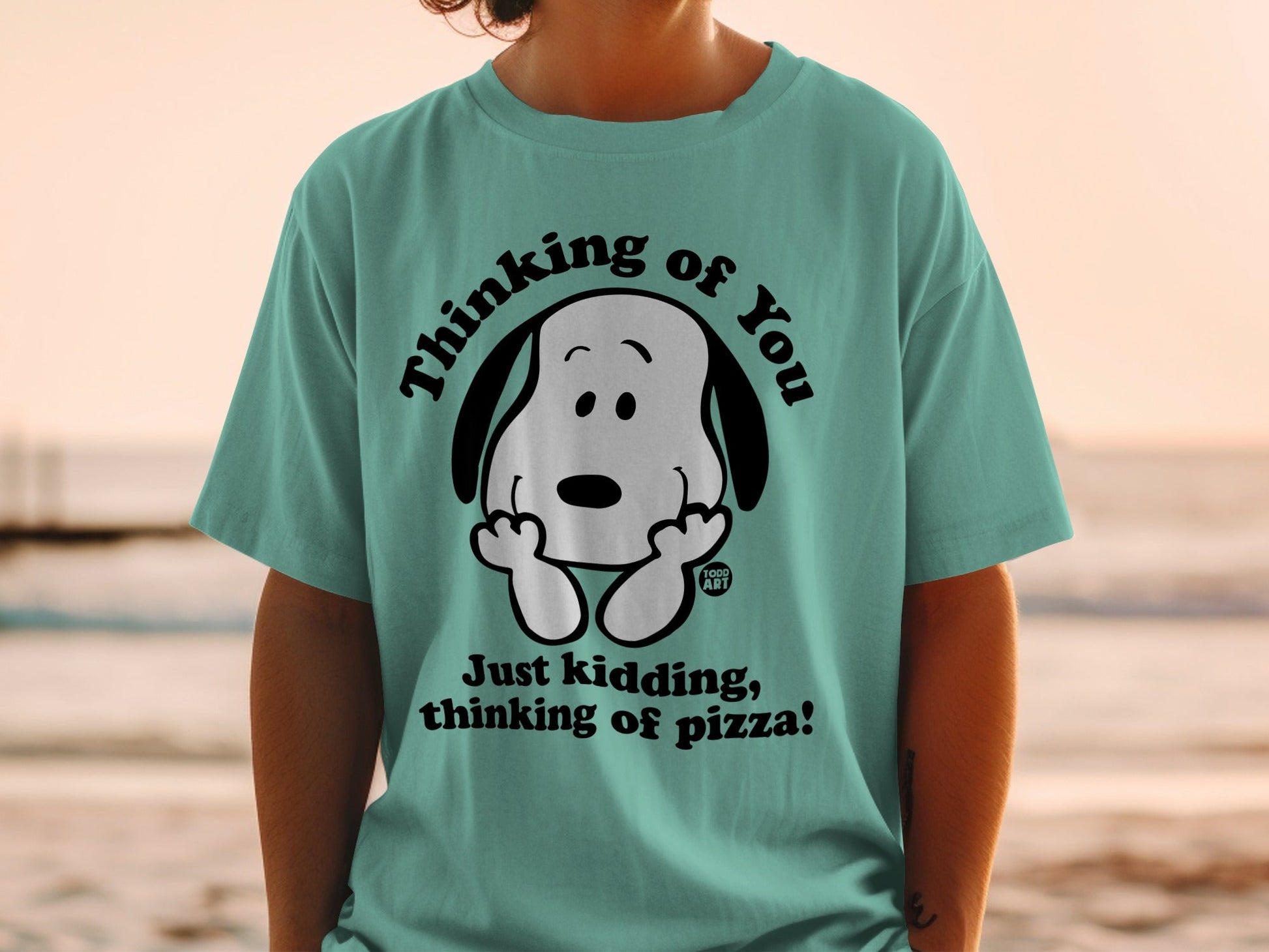 T-shirt with Snoopy thinking of pizza text.