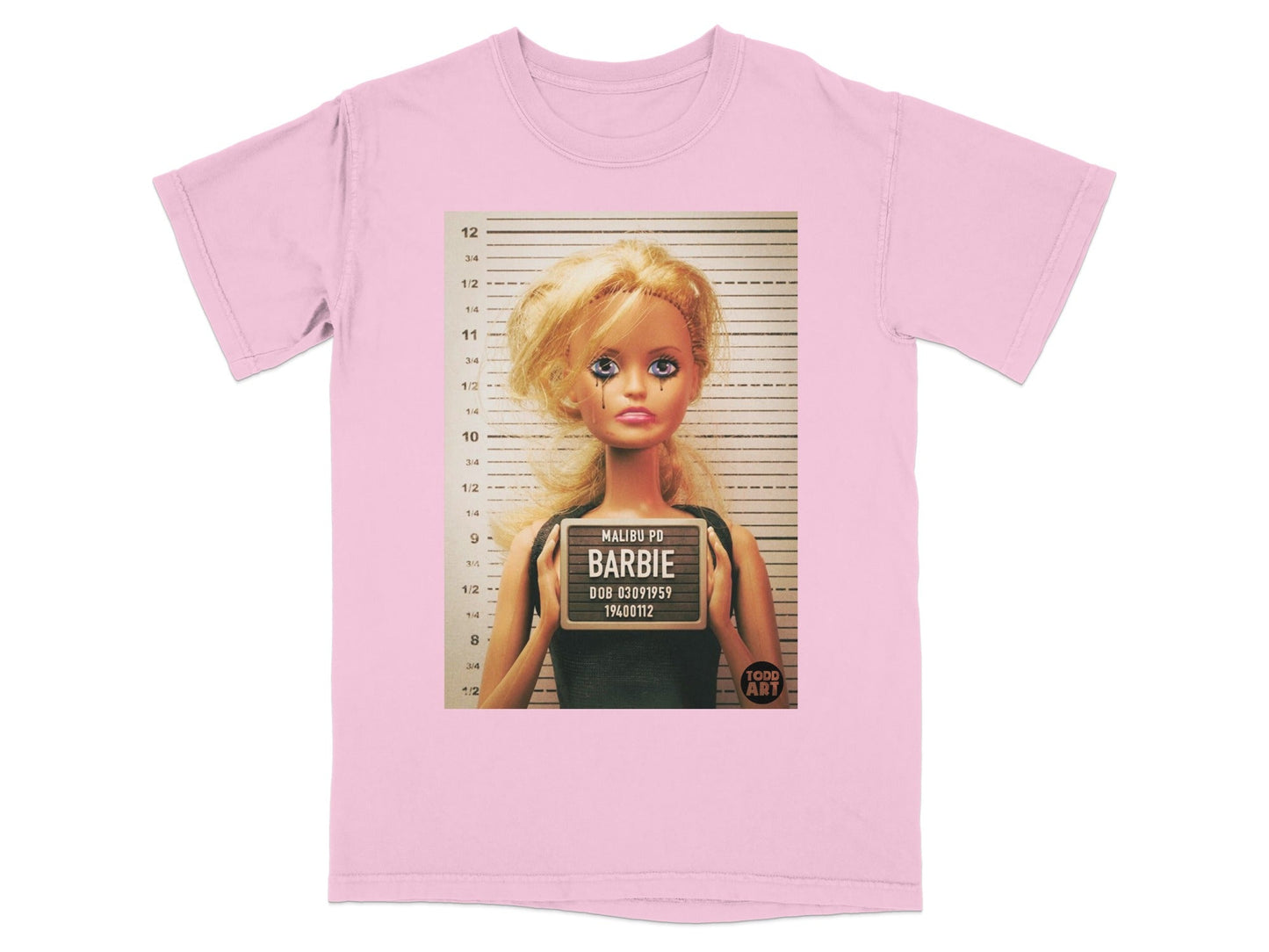 Pink t-shirt with Barbie mugshot and "Malibu PD Barbie" text.