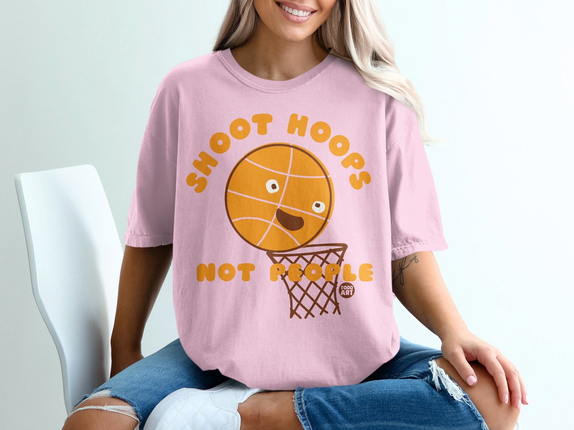 Pink t-shirt with "SHOOT HOOPS" and a cartoon basketball in a net.