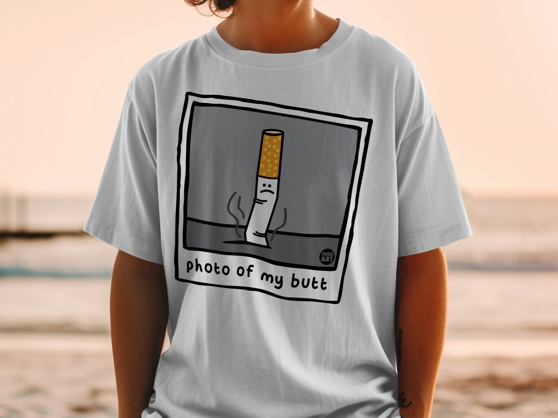 T-shirt with cartoon cigarette stub and "photo of my butt" text.