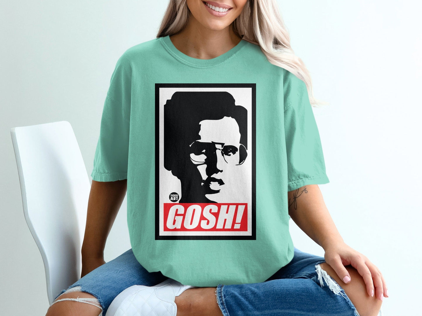 Graphic tee with black and white portrait and "GOSH!" text.