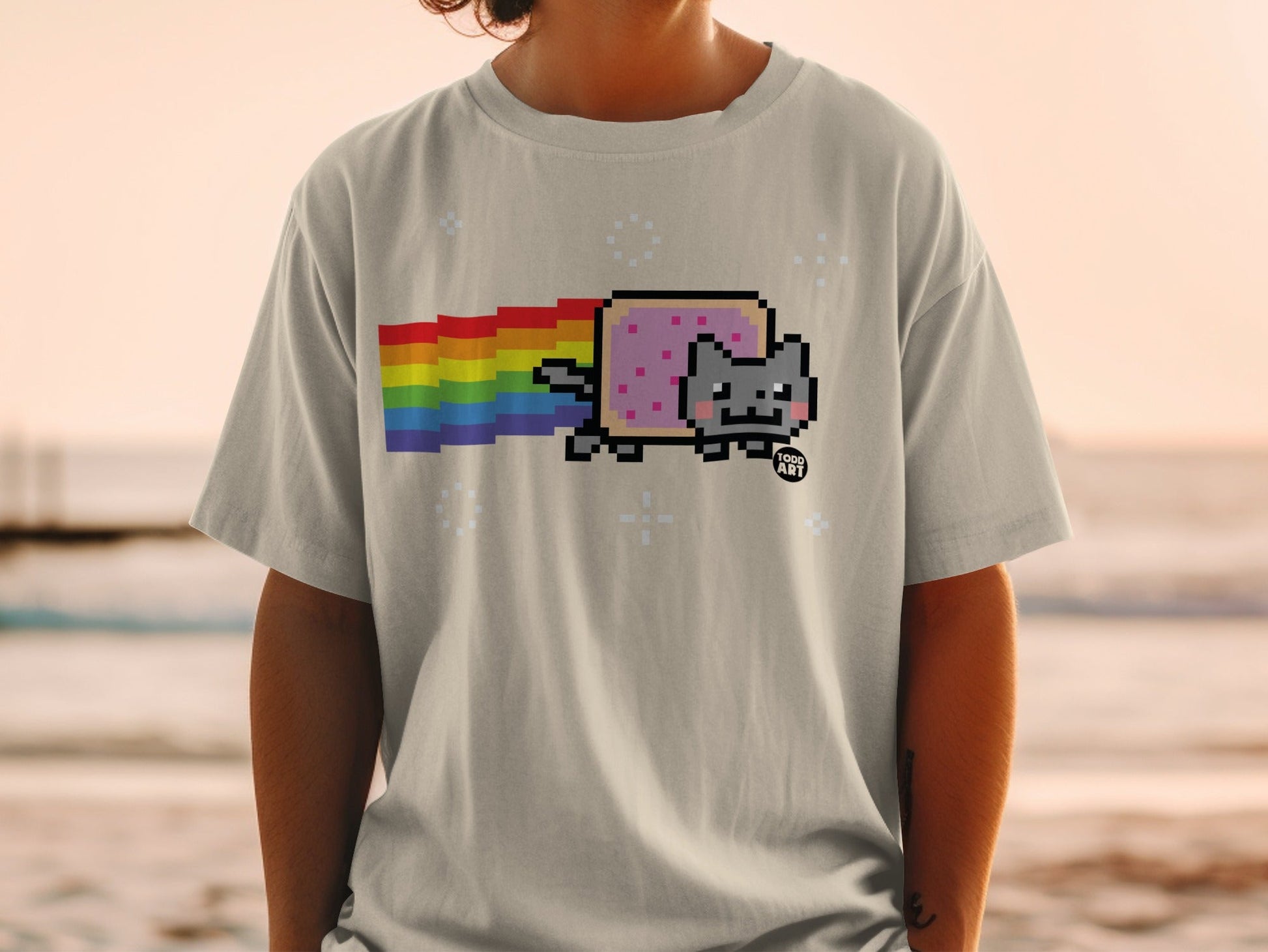 Light gray t-shirt with Nyan Cat and rainbow graphic.