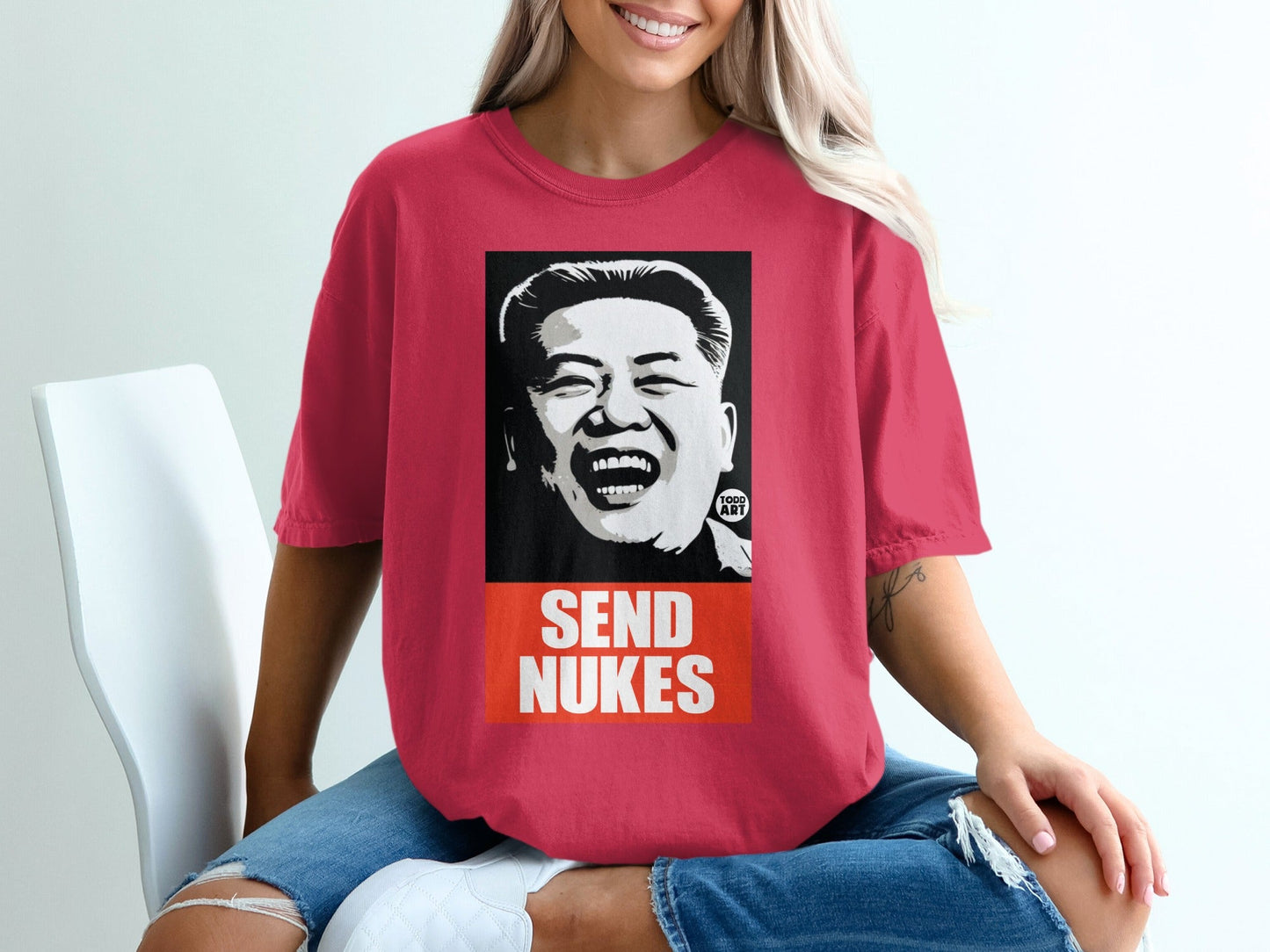 T-shirt with black and white portrait of Kim Jong Un and "SEND NUKES" text.