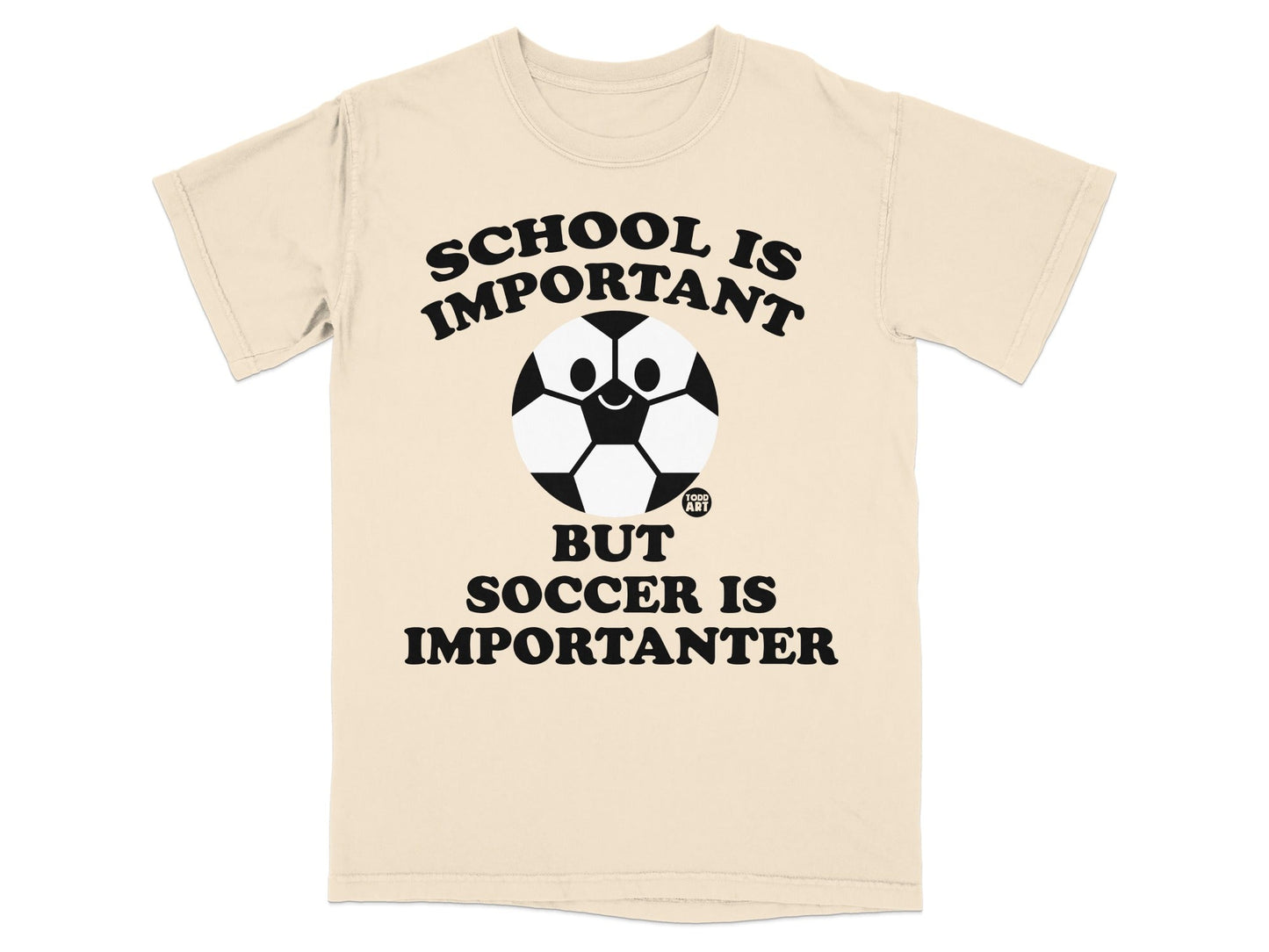 T-shirt with "SCHOOL IS IMPORTANT BUT SOCCER IS IMPORTANTER" and a smiling soccer ball.