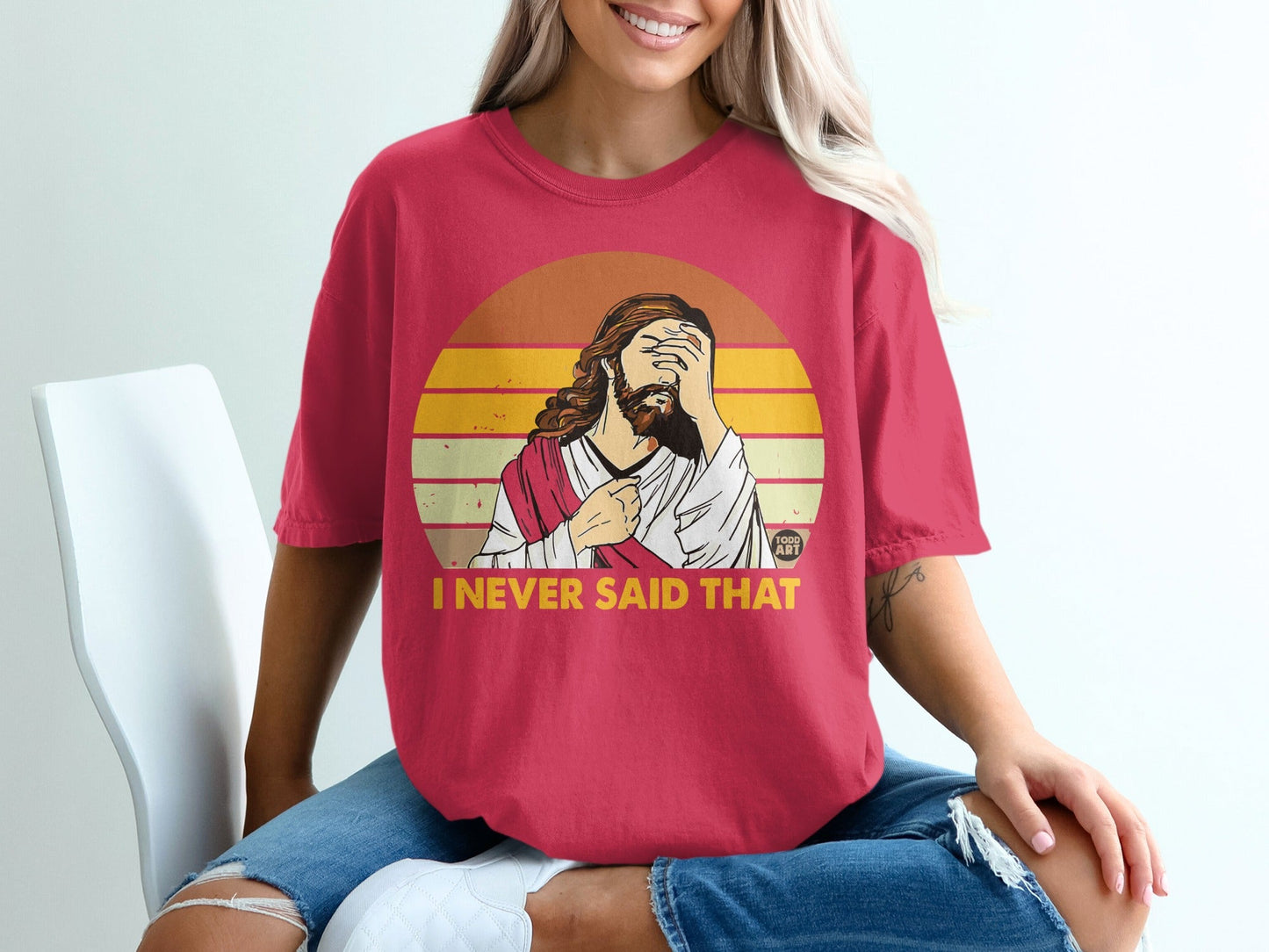 Jesus with hand over face on red t-shirt, text I NEVER SAID THAT.