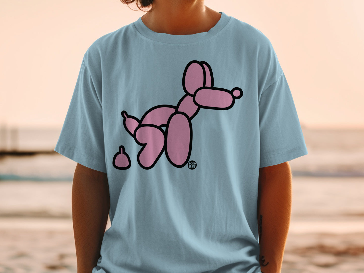 Light blue t-shirt with a pink balloon dog and its poop.