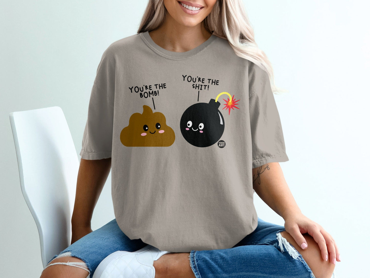 Brown t-shirt with "You're the bomb! You're the shit!" cartoon text and graphics.