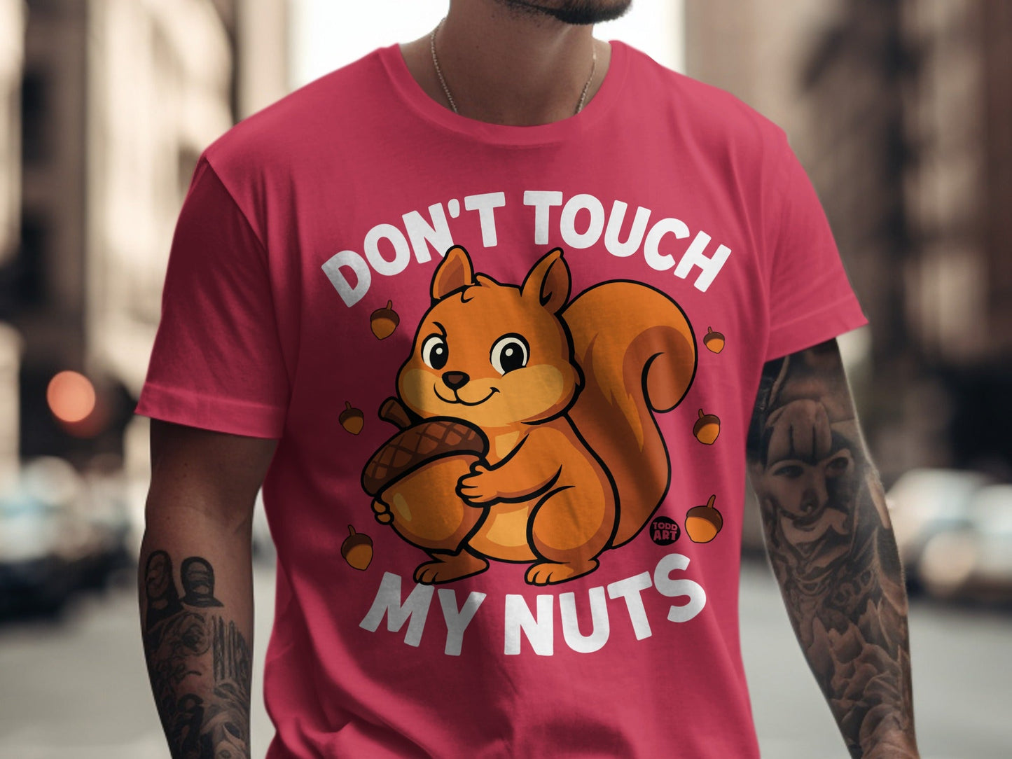 T-shirt with cartoon squirrel holding acorn and text "Don't Touch My Nuts".