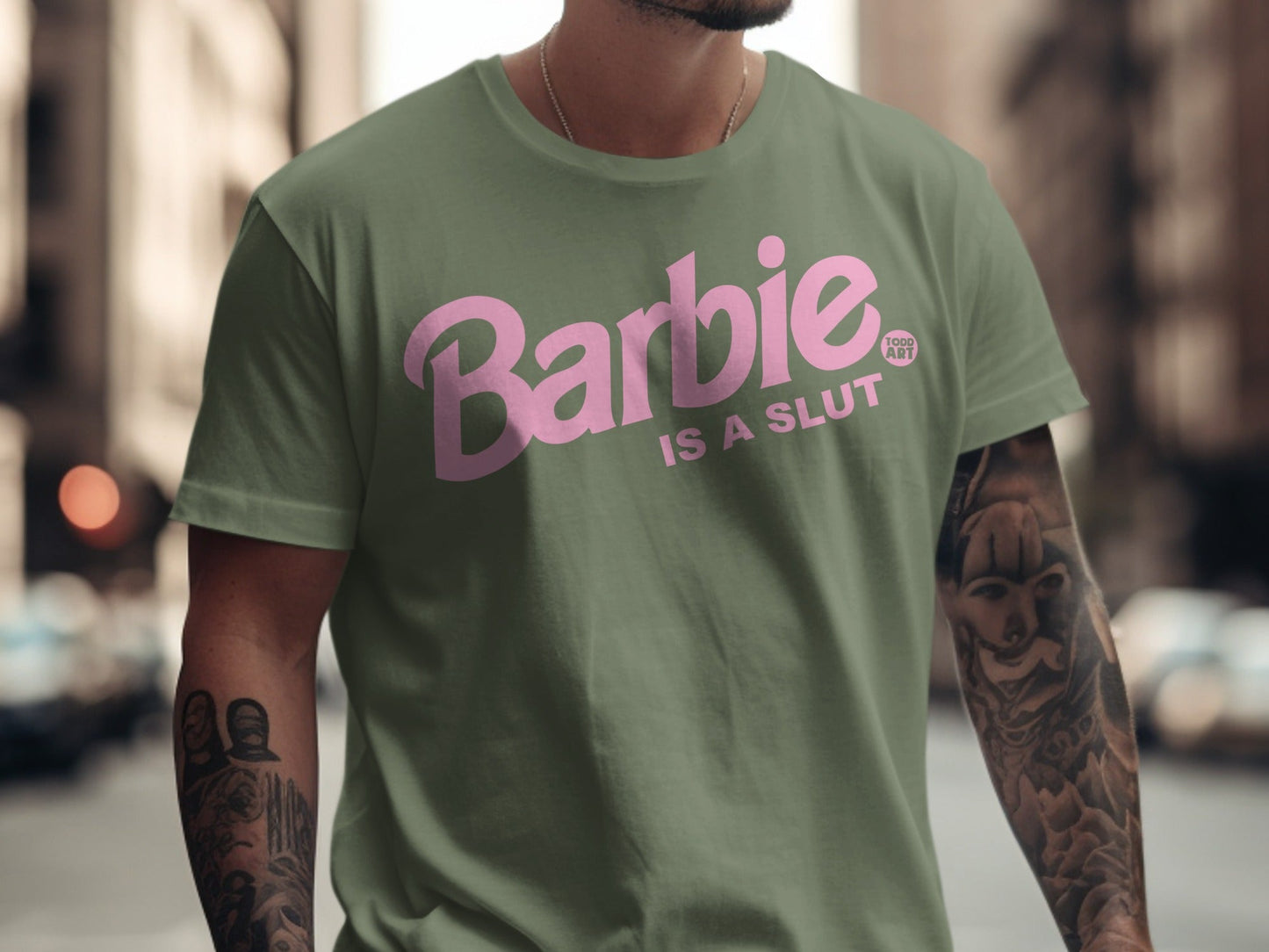 Green t-shirt with pink "Barbie IS A SLUT" text and "FOOD ART" logo.
