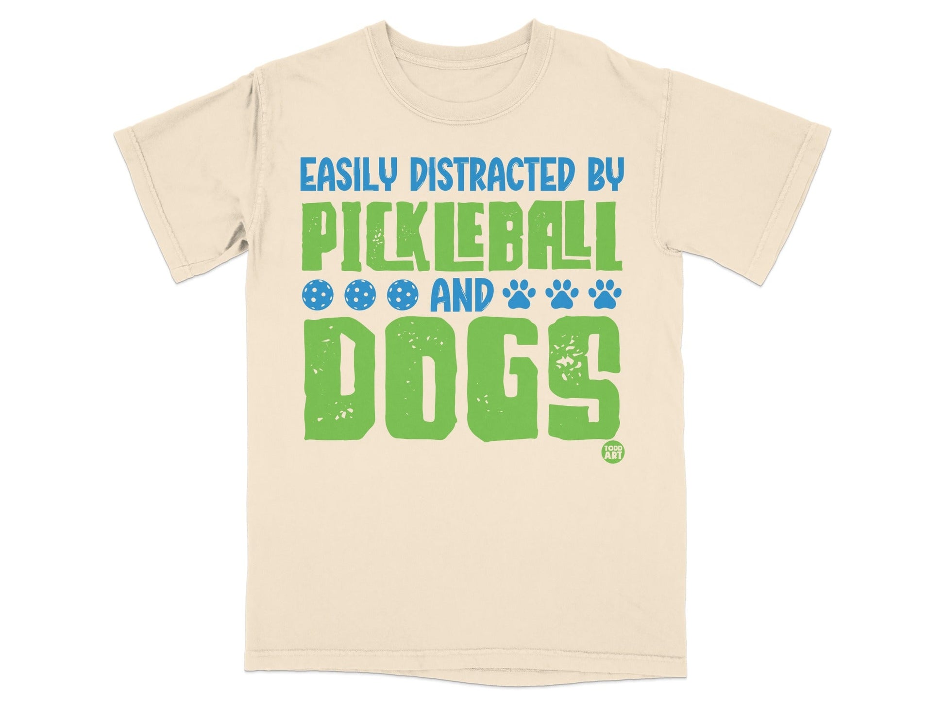 Cream t-shirt with "Easily Distracted by Pickleball and Dogs" text and graphics.