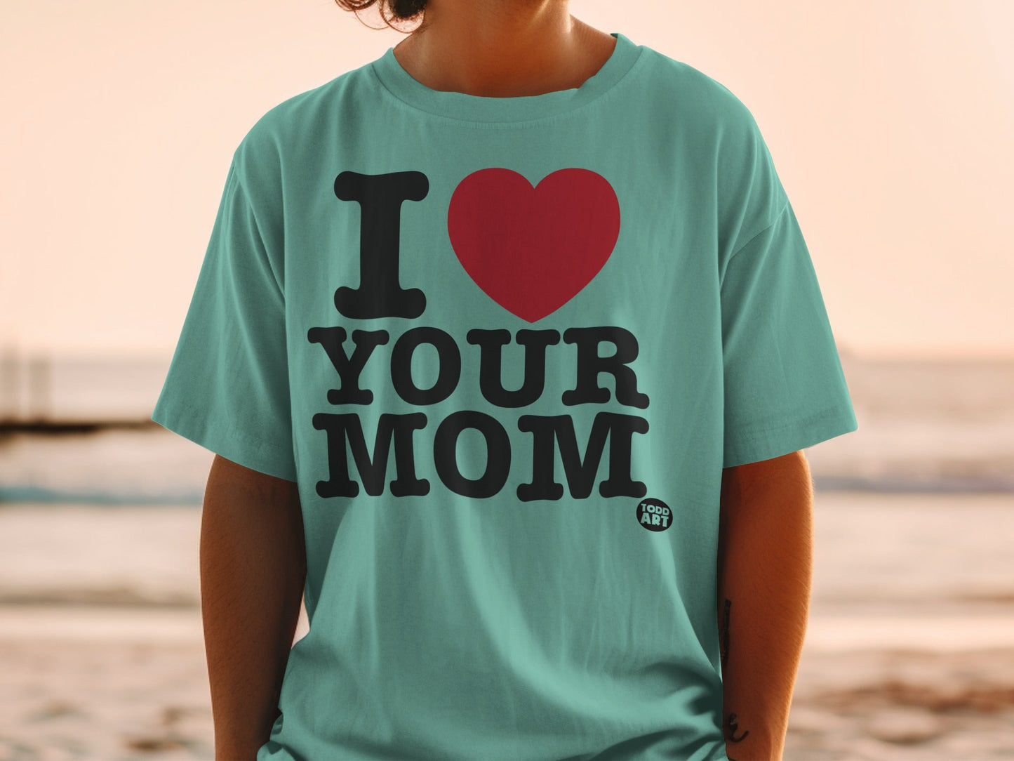 Teal t-shirt with "I ‚ô• YOUR MOM" text and a small "FOOD ART" logo.