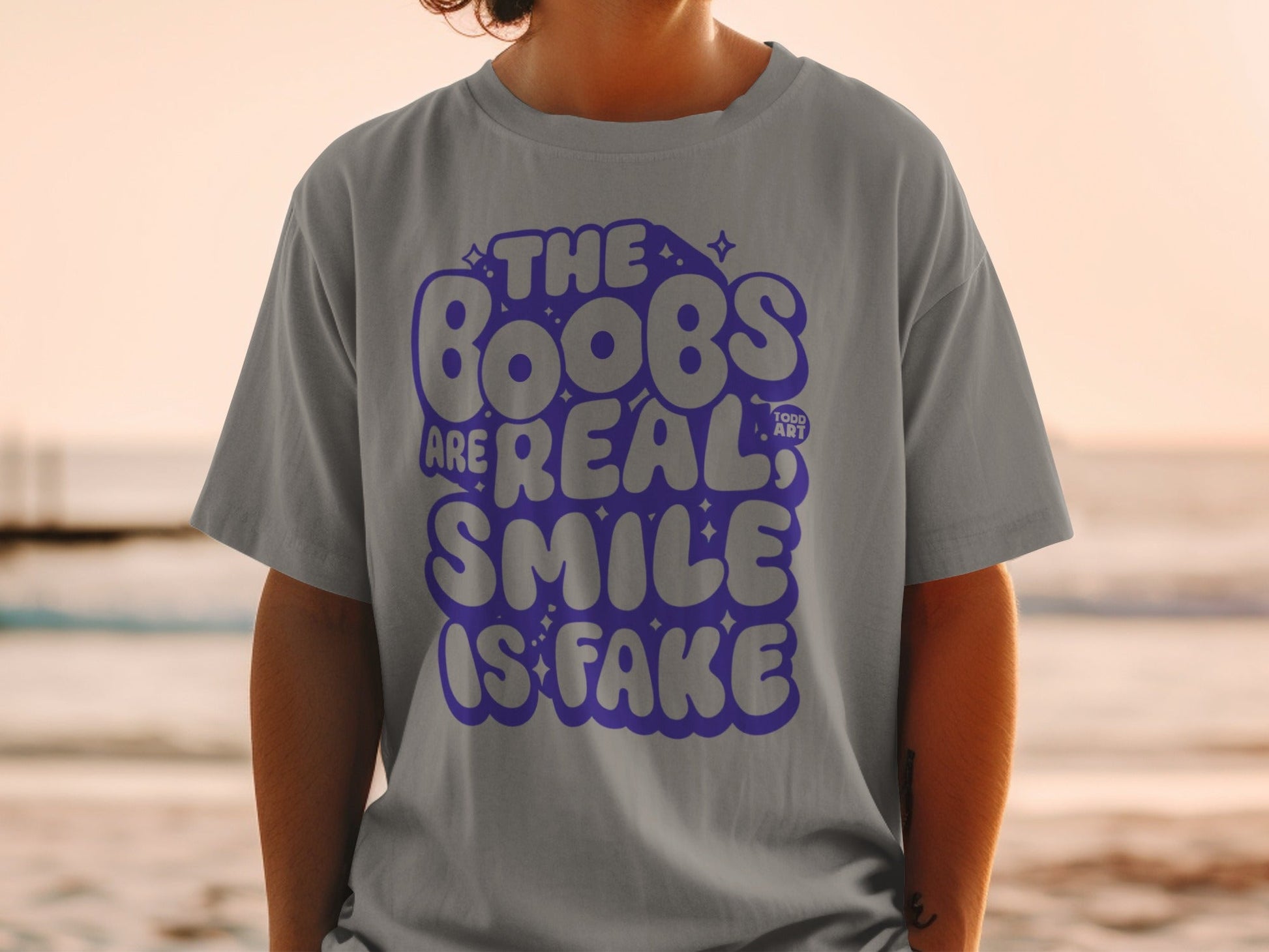 The Boobs Are Real Smile Is Fake Graphic Tee