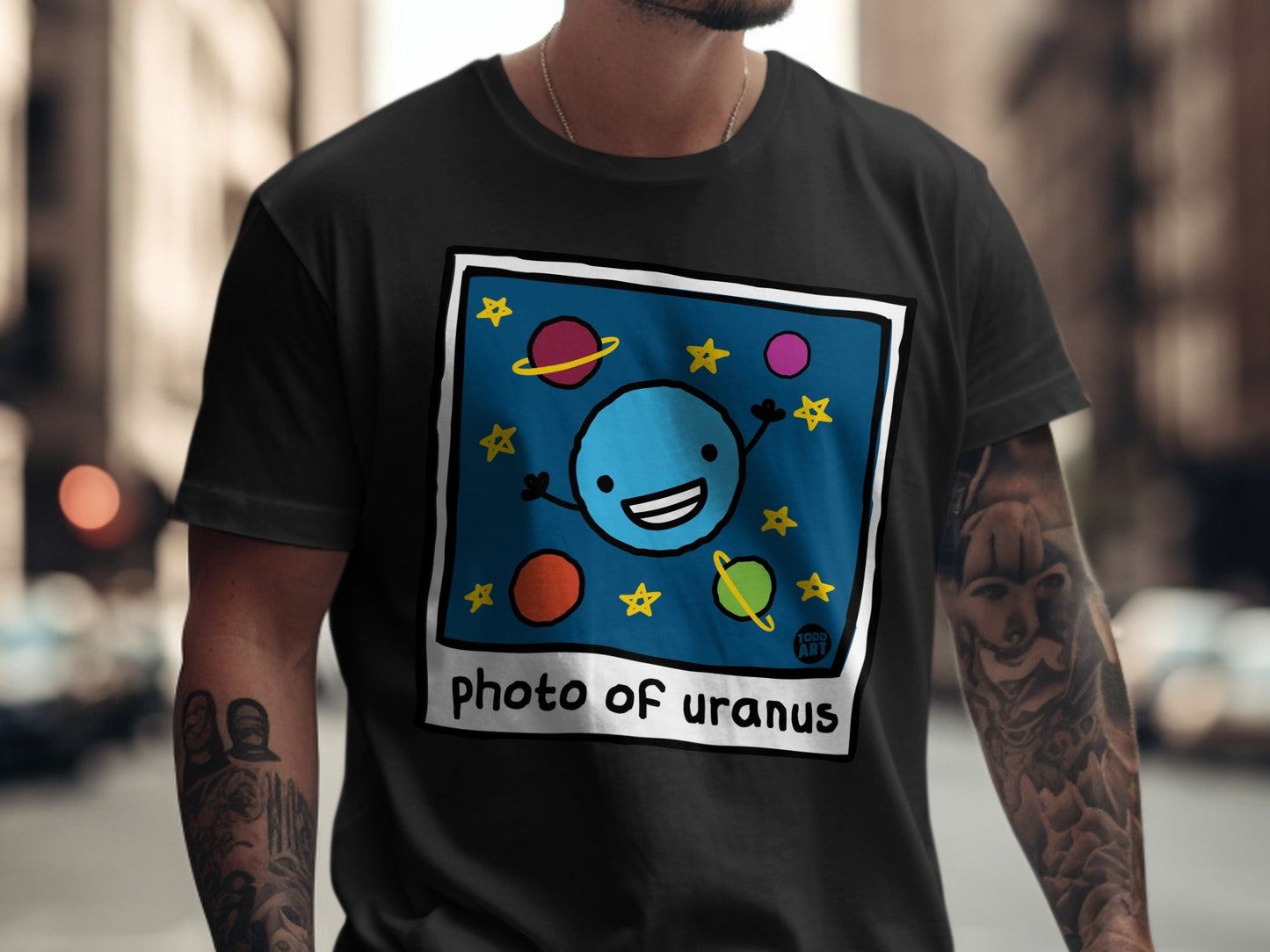 Cartoon smiling blue planet with stars and text "photo of uranus".