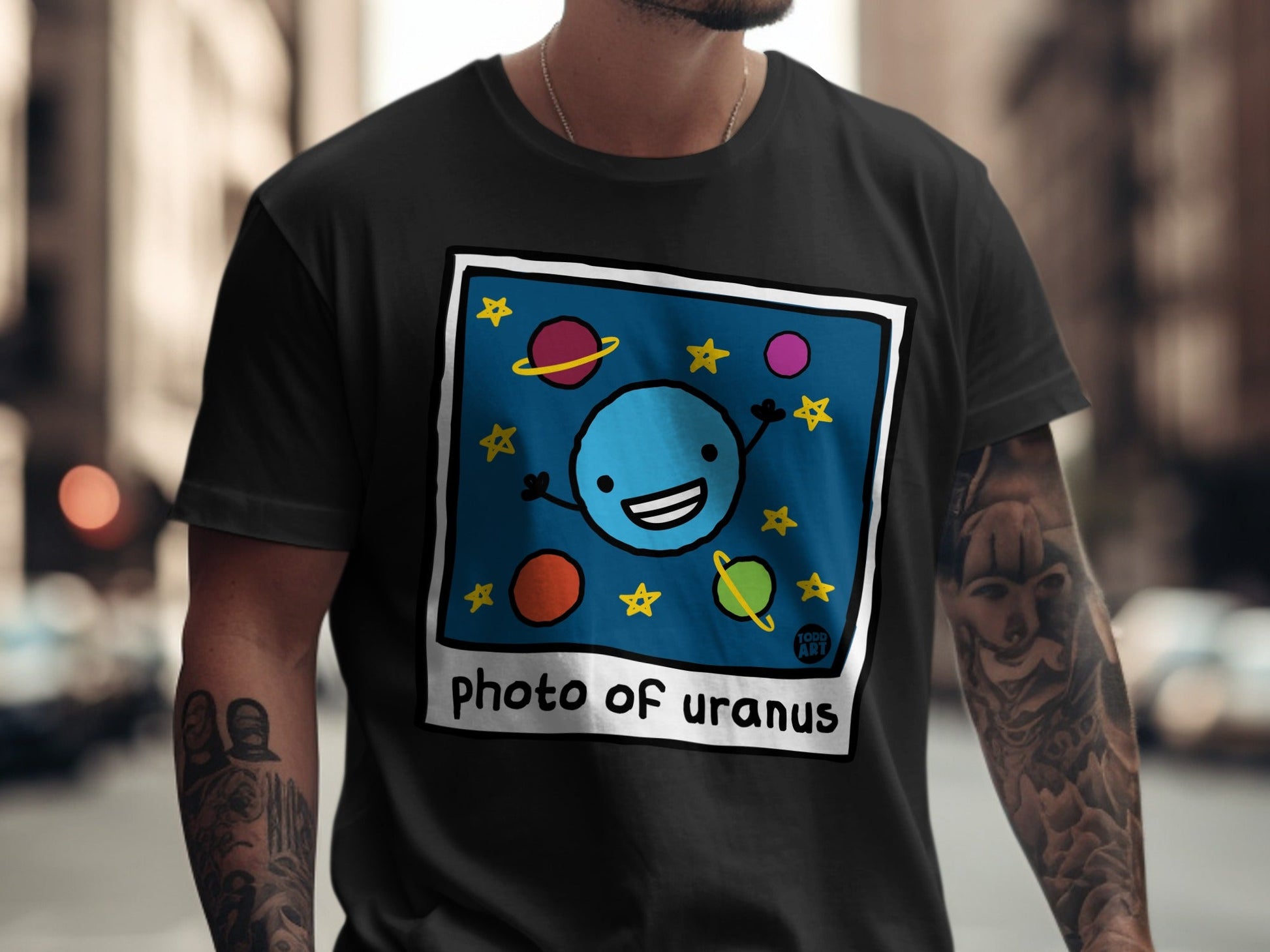 Cartoon smiling blue planet with stars and text "photo of uranus".