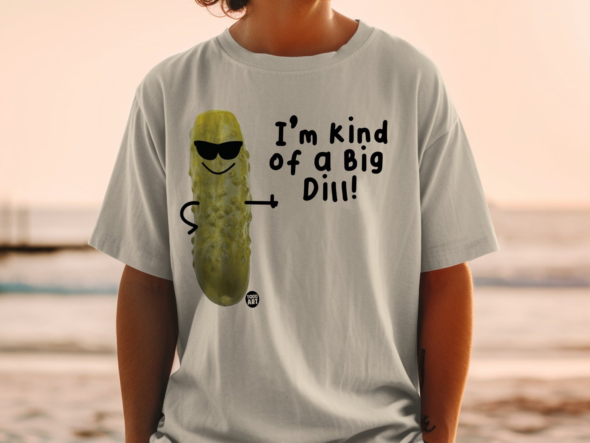 T-shirt with cartoon pickle wearing sunglasses and text "I'm kind of a Big Dill!".