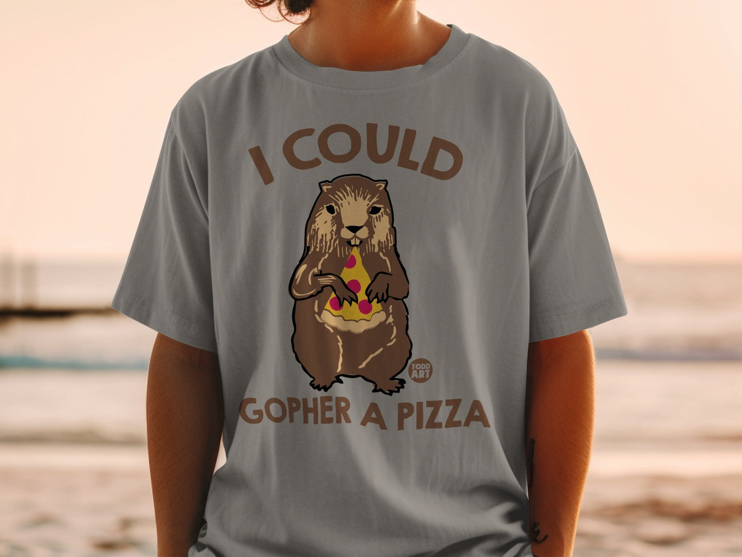 Groundhog wearing a t-shirt with "I COULD GOPHER A PIZZA" text.