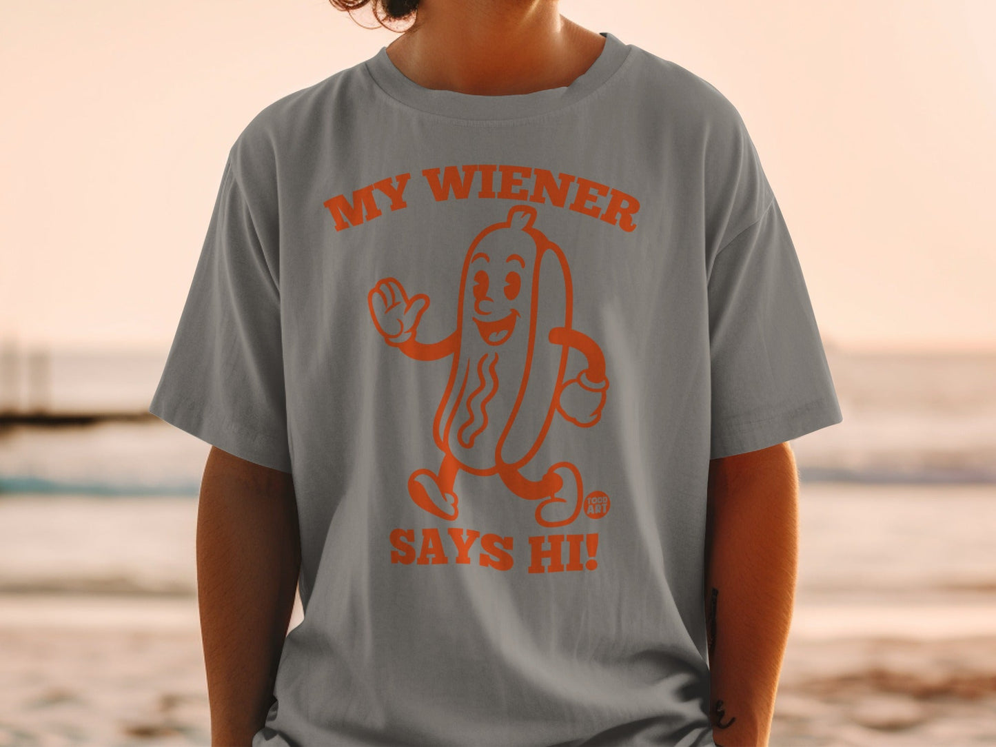 Gray t-shirt with orange hot dog graphic that says "My Wiener Says Hi!"