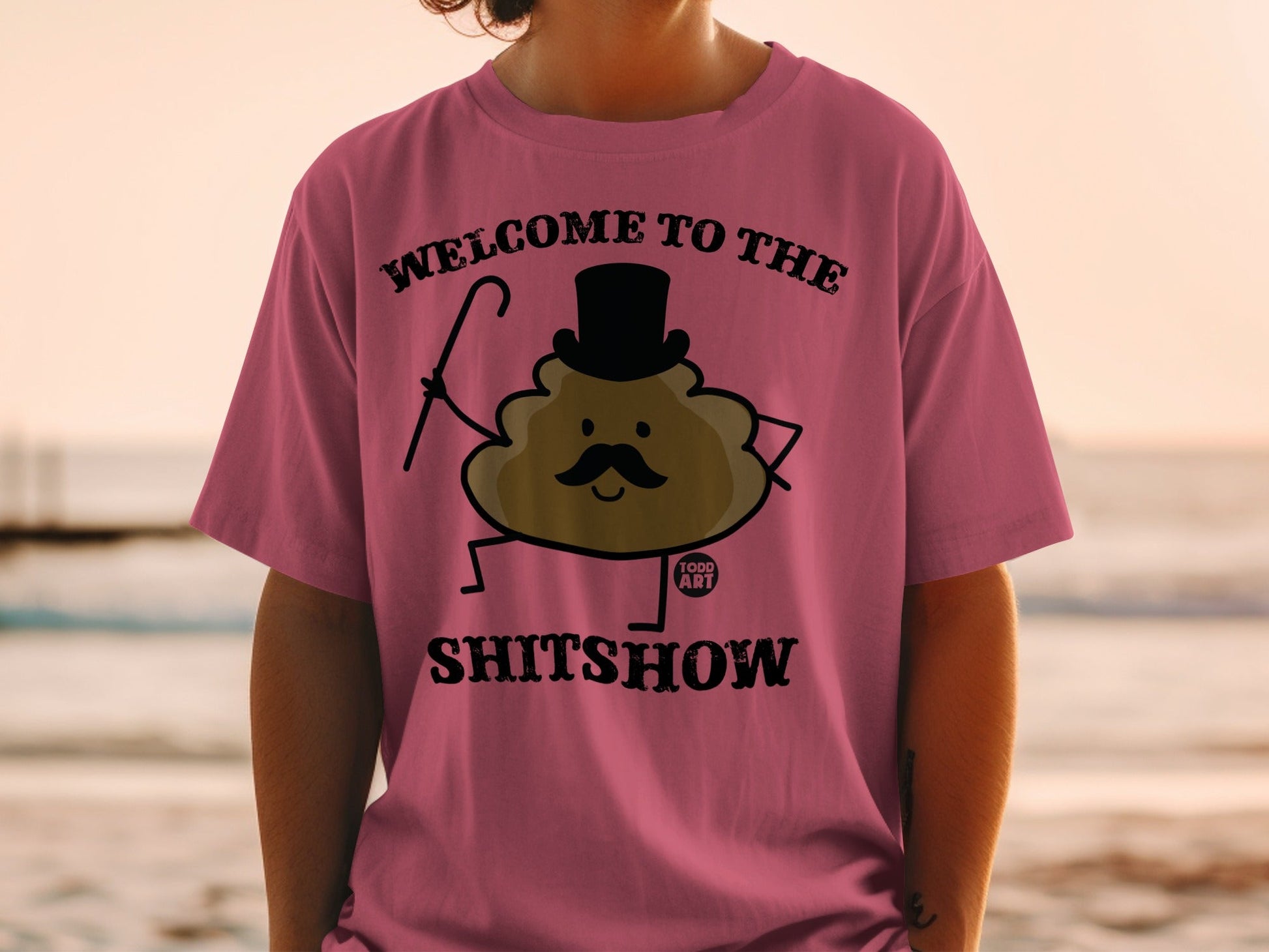 T-shirt with cartoon poop wearing top hat and cane, text "WELCOME TO THE SHITSHOW".
