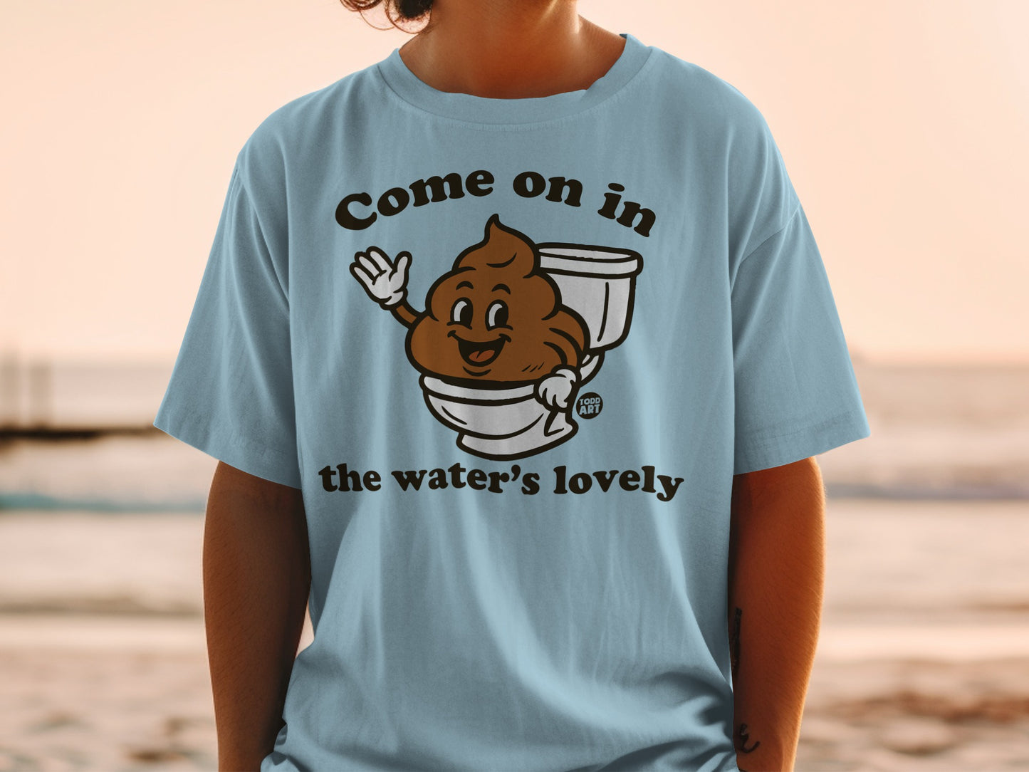T-shirt with smiling poop character in a toilet, text reads "Come on in the water's lovely".