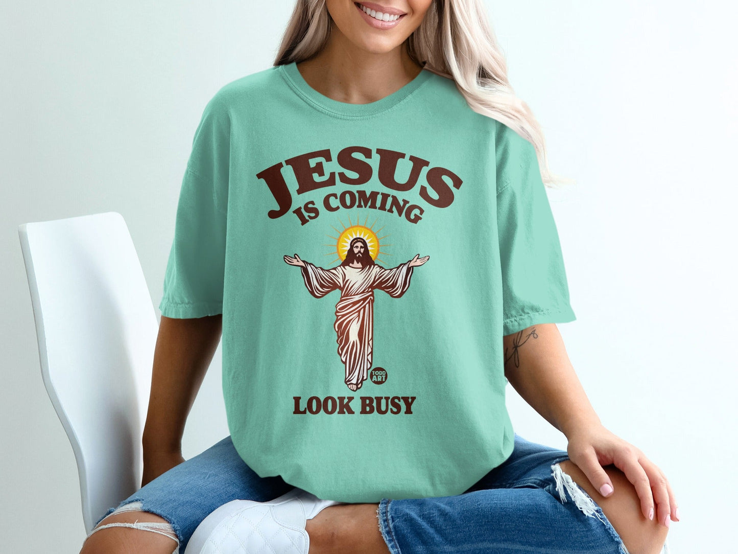 Jesus is coming, look busy graphic t-shirt with religious imagery.