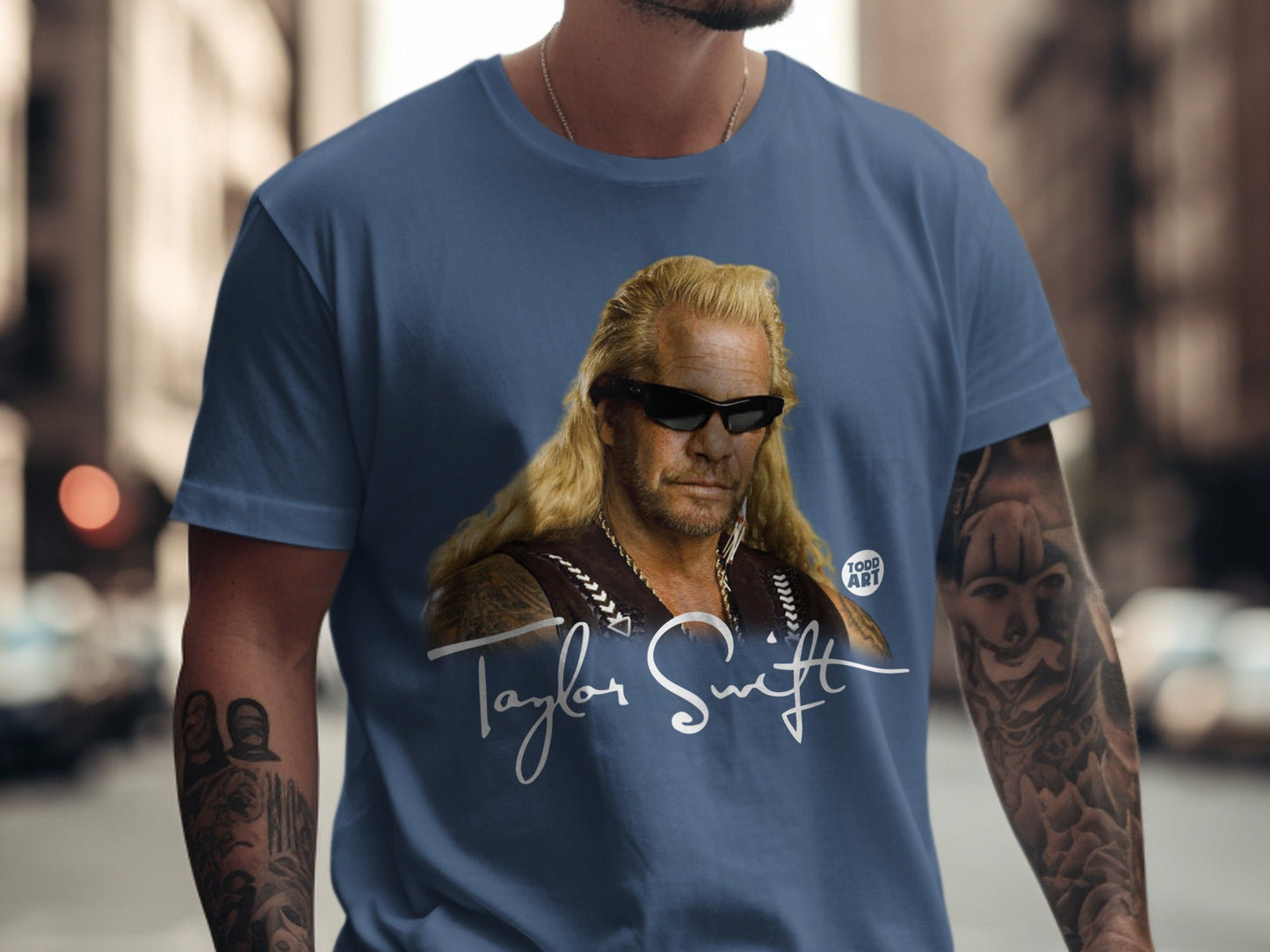 Blue t-shirt with Dog the Bounty Hunter and "Taylor Swift" text.