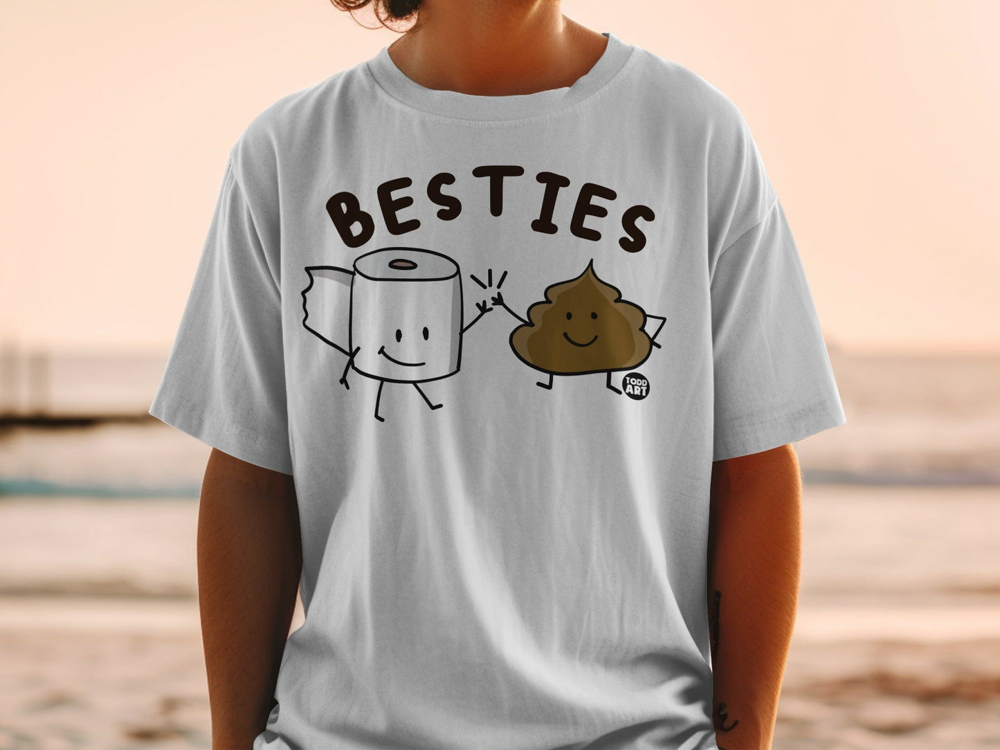 White t-shirt with cartoon toilet paper roll and poop characters giving a high five.