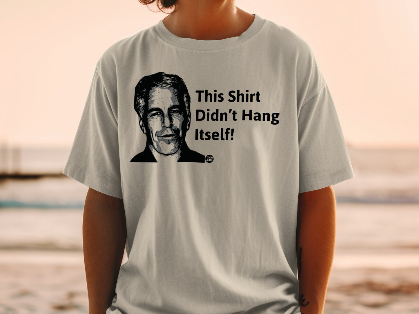 T-shirt with black and white portrait and text "This Shirt Didn't Hang Itself!"
