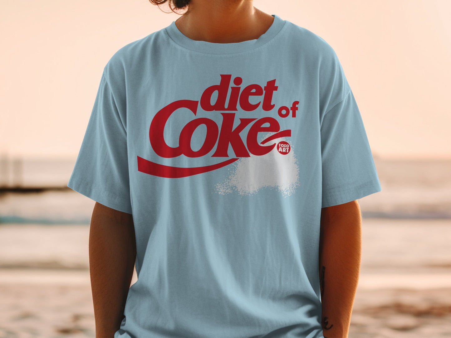 Light blue t-shirt with red Diet Coke logo and sugar graphic.