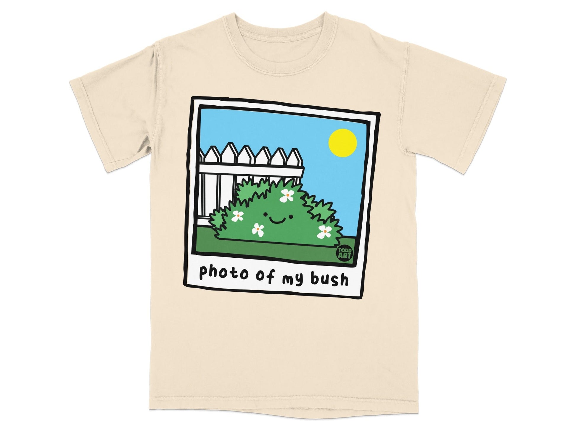 T-shirt with a cartoon bush with a white picket fence and sun.