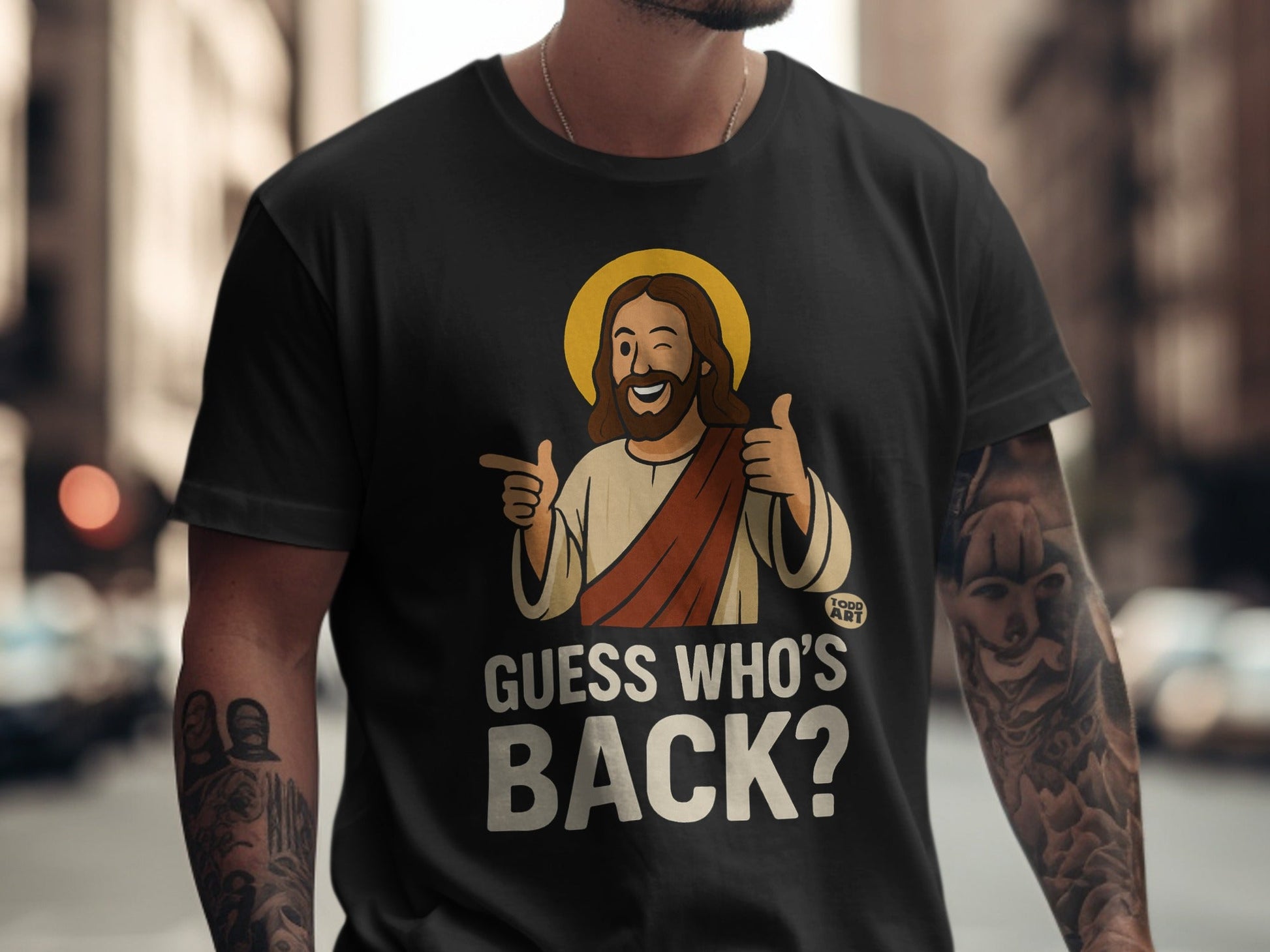 Black t-shirt with Jesus graphic saying "Guess Who's Back?".
