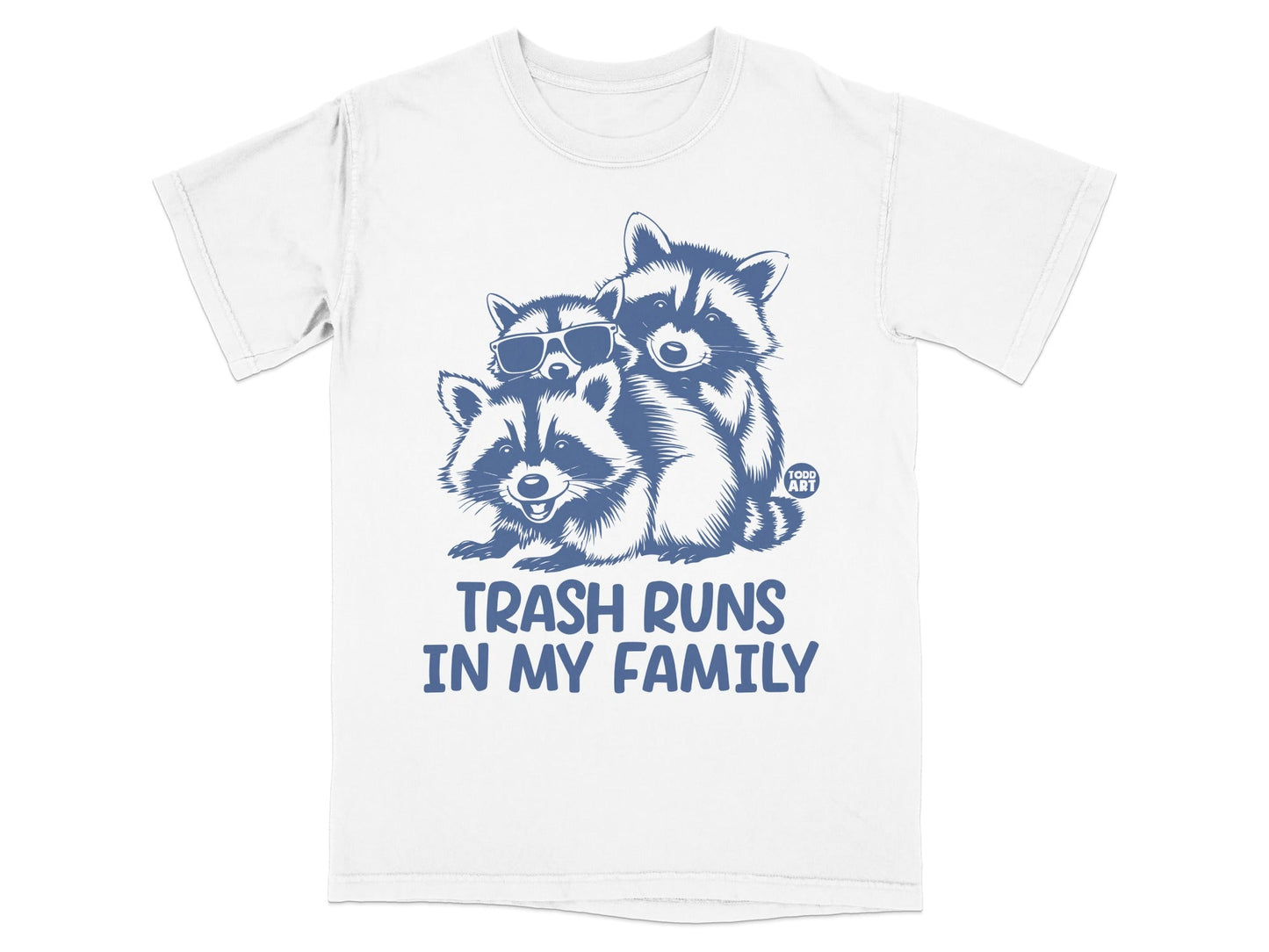 Blue graphic t-shirt with three raccoons and text "TRASH RUNS IN MY FAMILY".