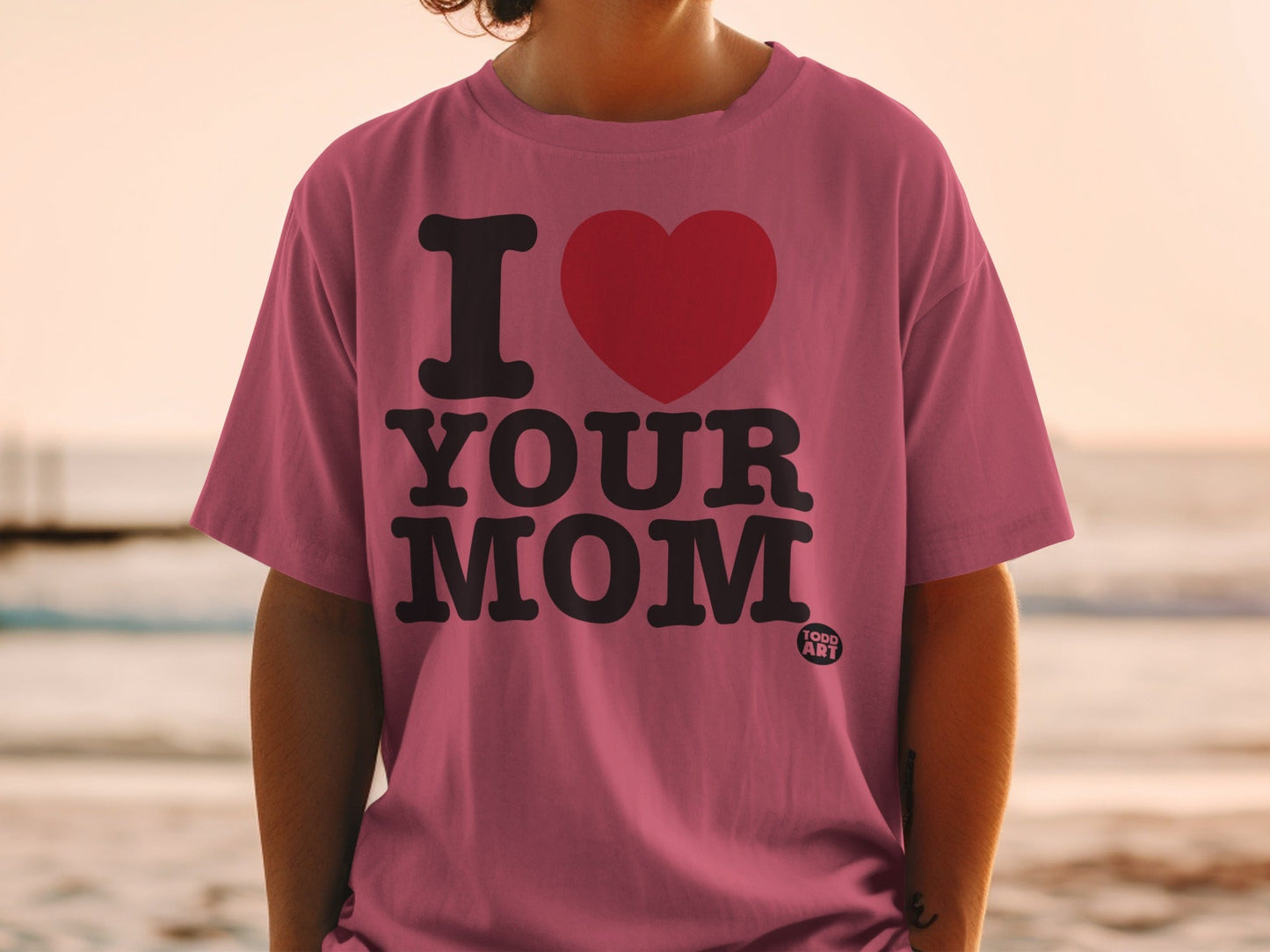 Pink t-shirt with "I ‚ù§Ô∏è YOUR MOM" text and a small "TOGO ART" logo.