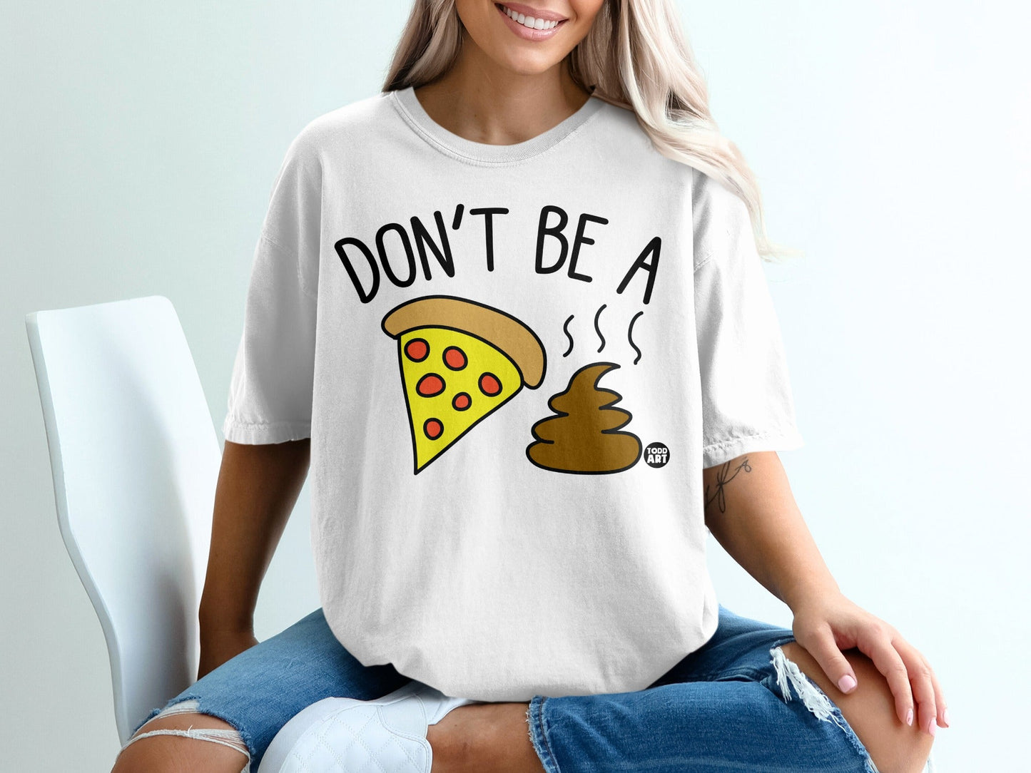 White t-shirt with "Don't be a pooh" pizza and poop graphic.