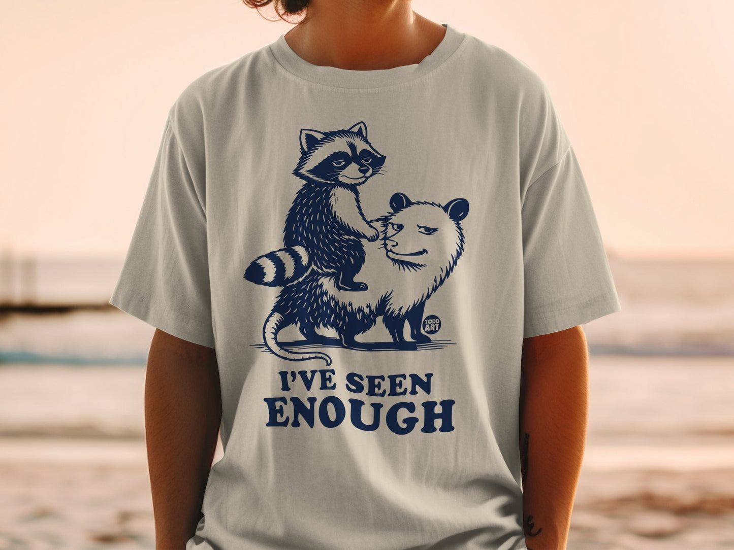 T-shirt with a raccoon riding an opossum, text "I'VE SEEN ENOUGH".