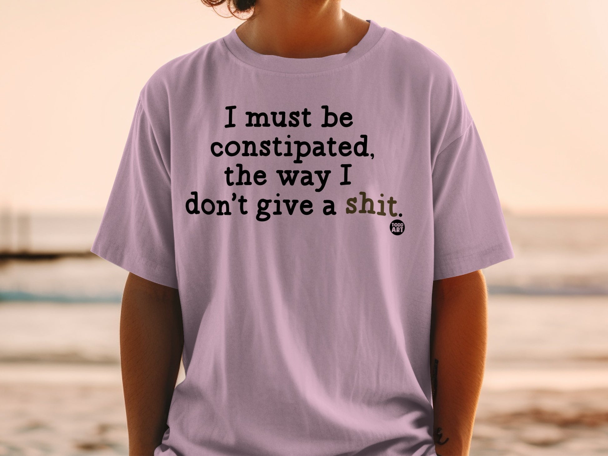 T-shirt with "I must be constipated, the way I don't give a shit" text.