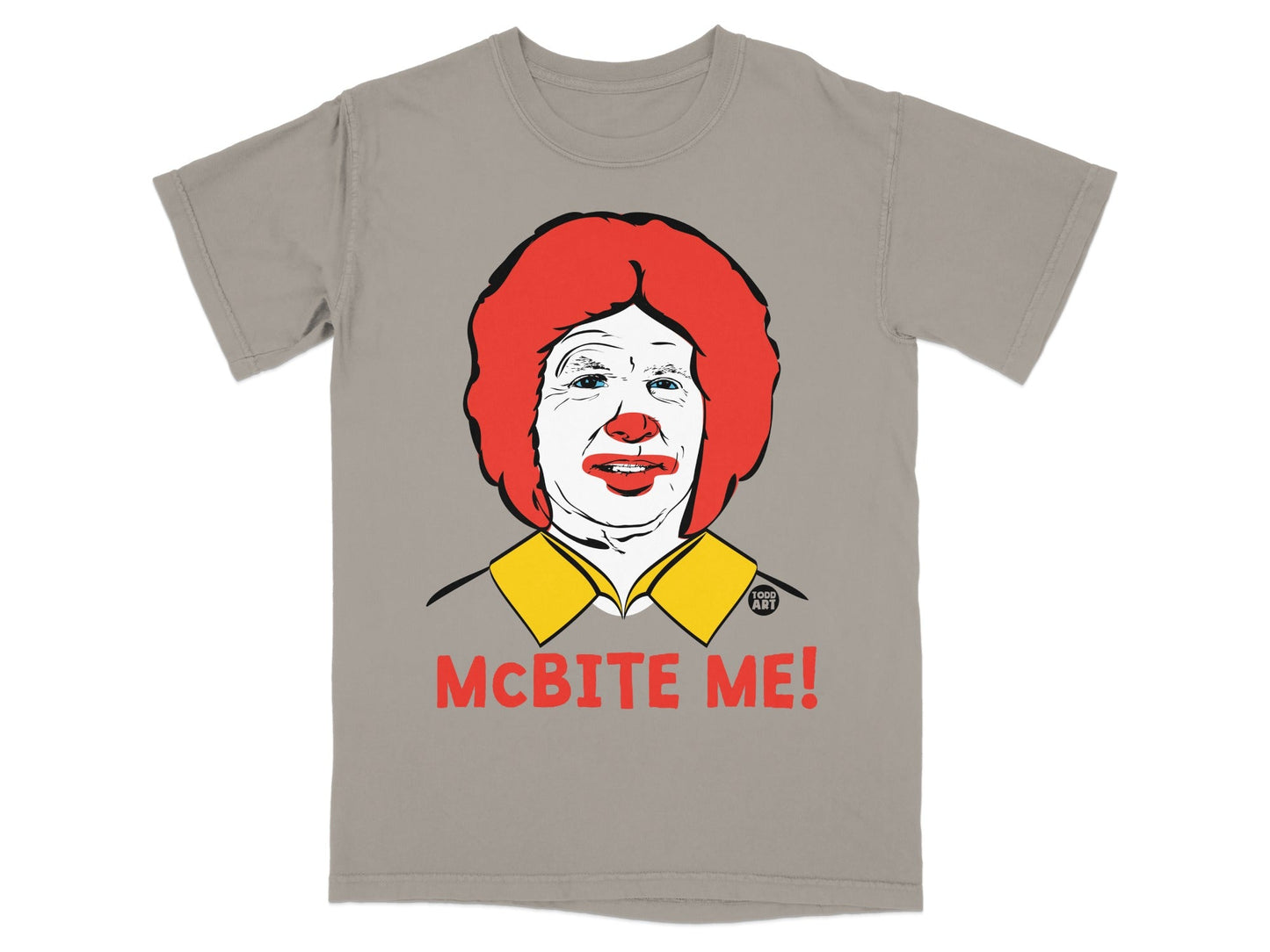 Gray t-shirt with a cartoon of Ronald McDonald and the text "MCBITE ME!".