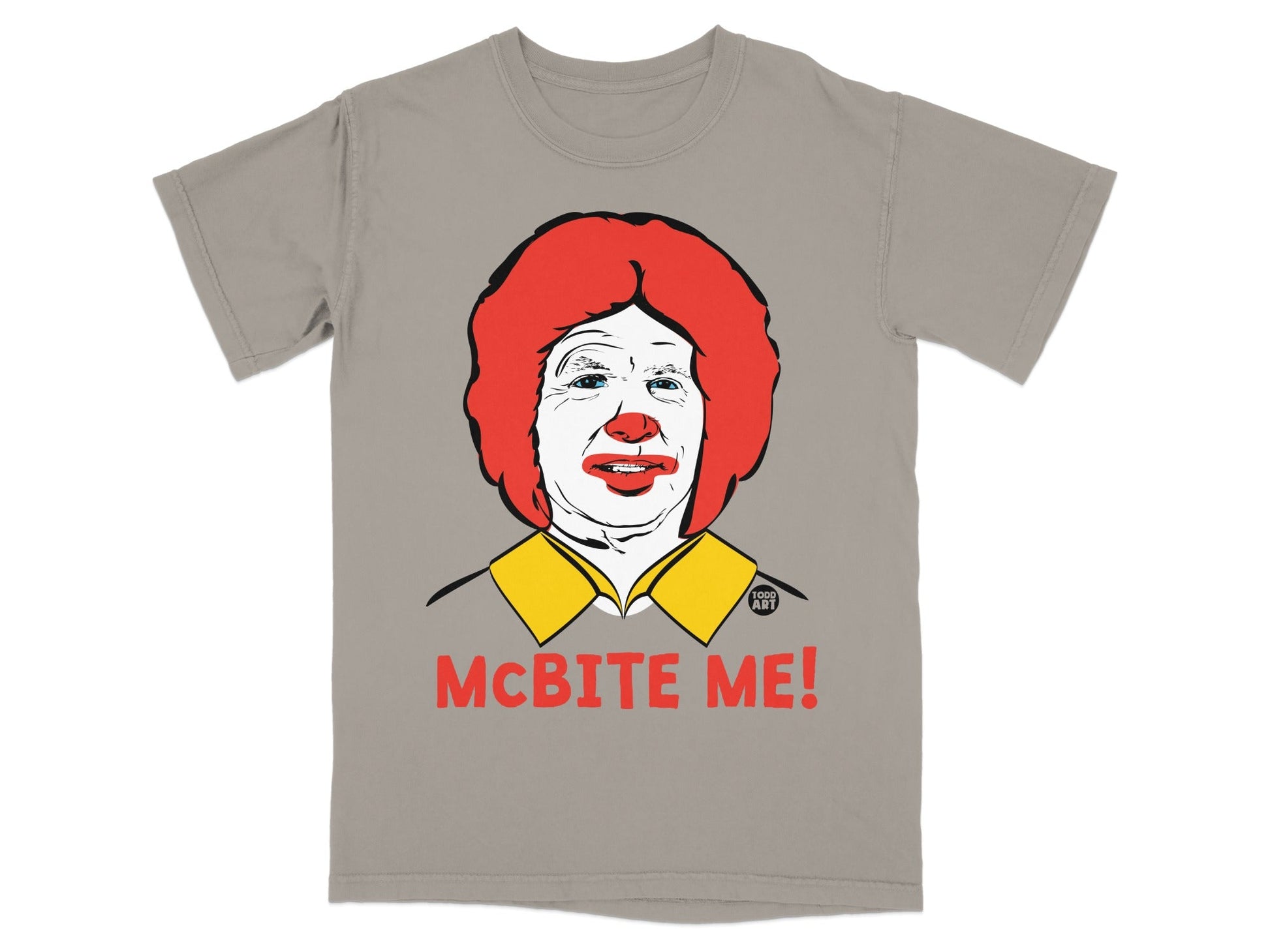 Gray t-shirt with a cartoon of Ronald McDonald and the text "MCBITE ME!".