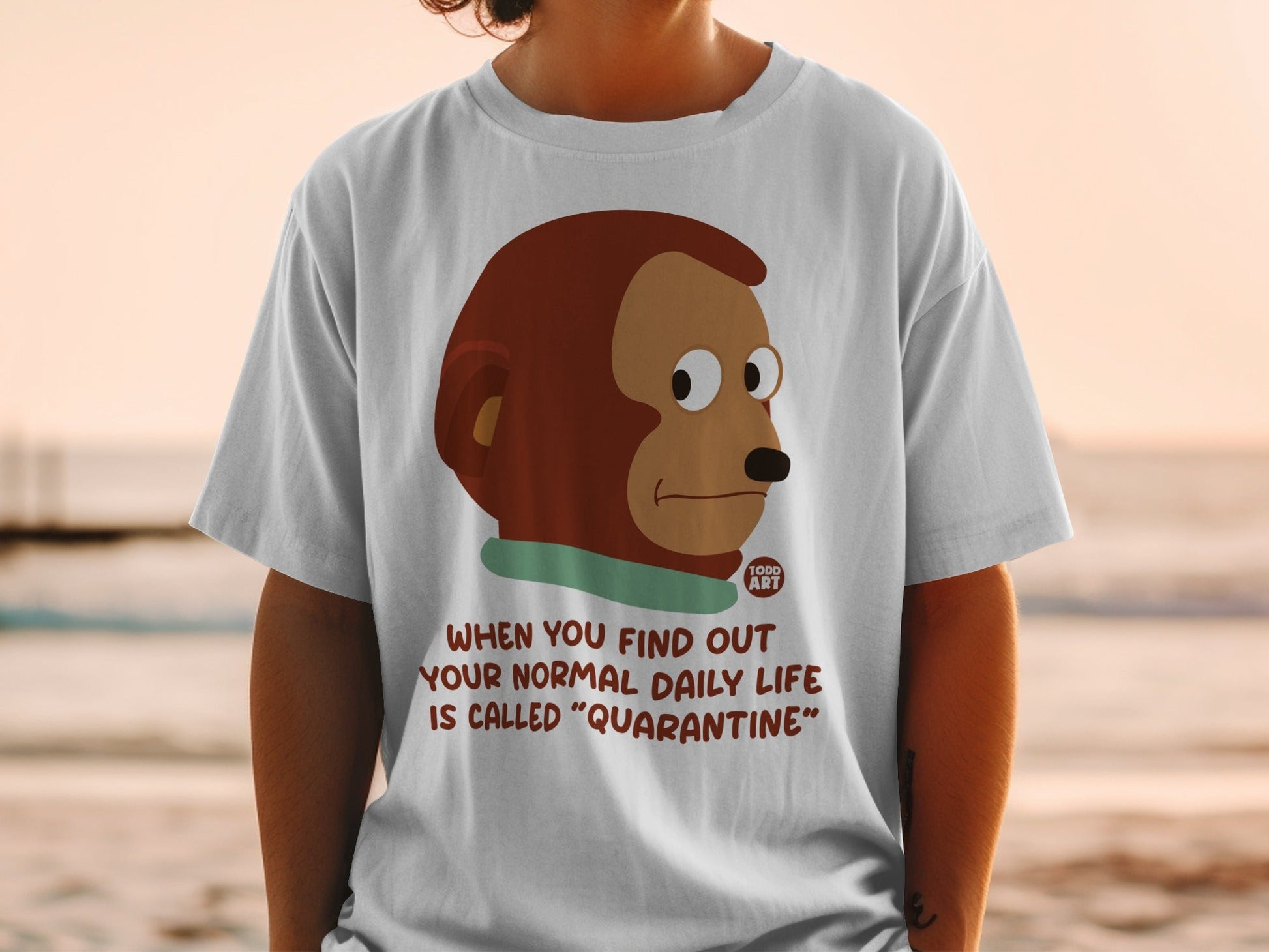 T-shirt with cartoon monkey and text "When you find out your normal daily life is called 'Quarantine'".