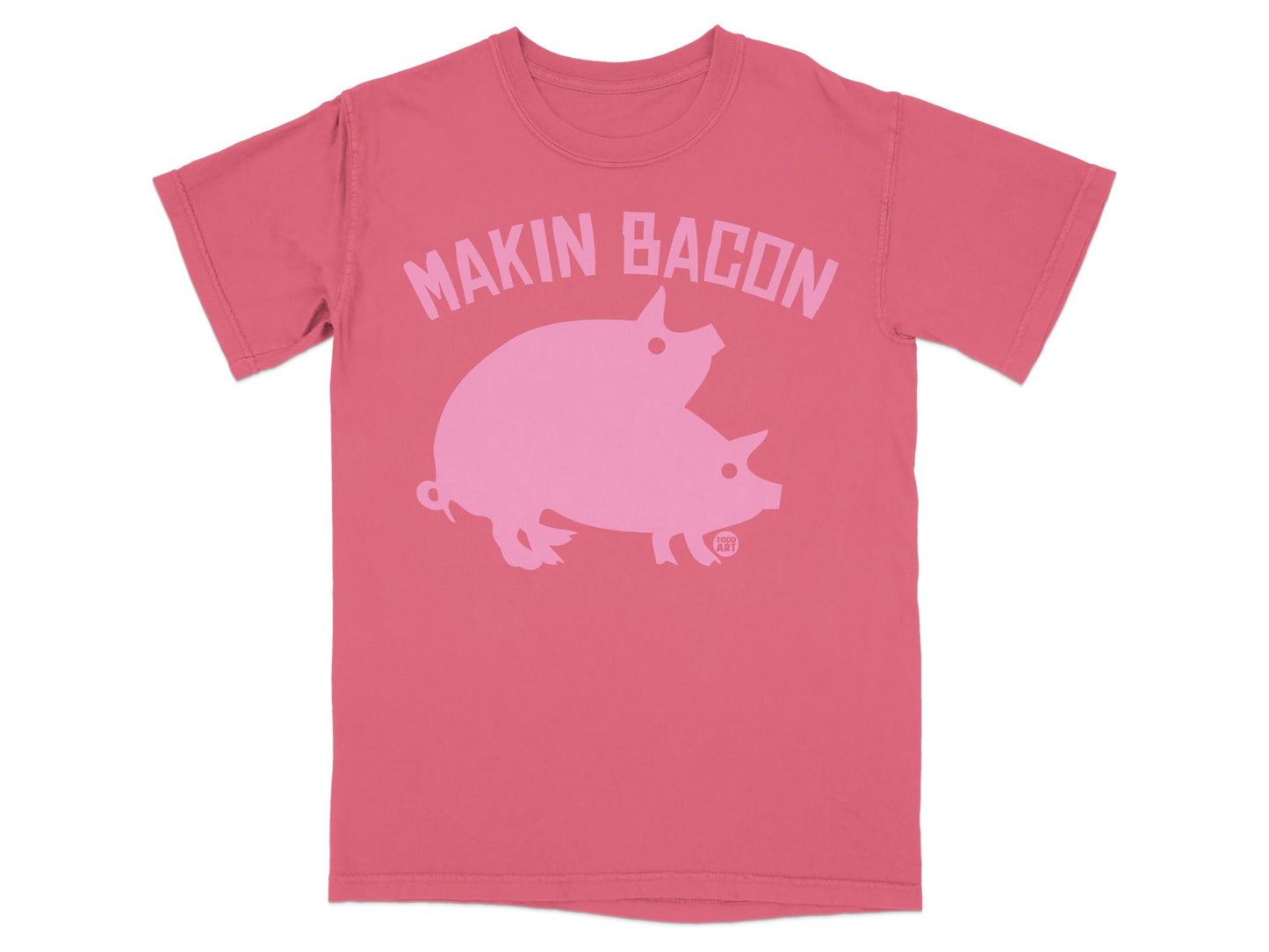 Pink t-shirt with "Makin Bacon" text and two pink pigs silhouette.