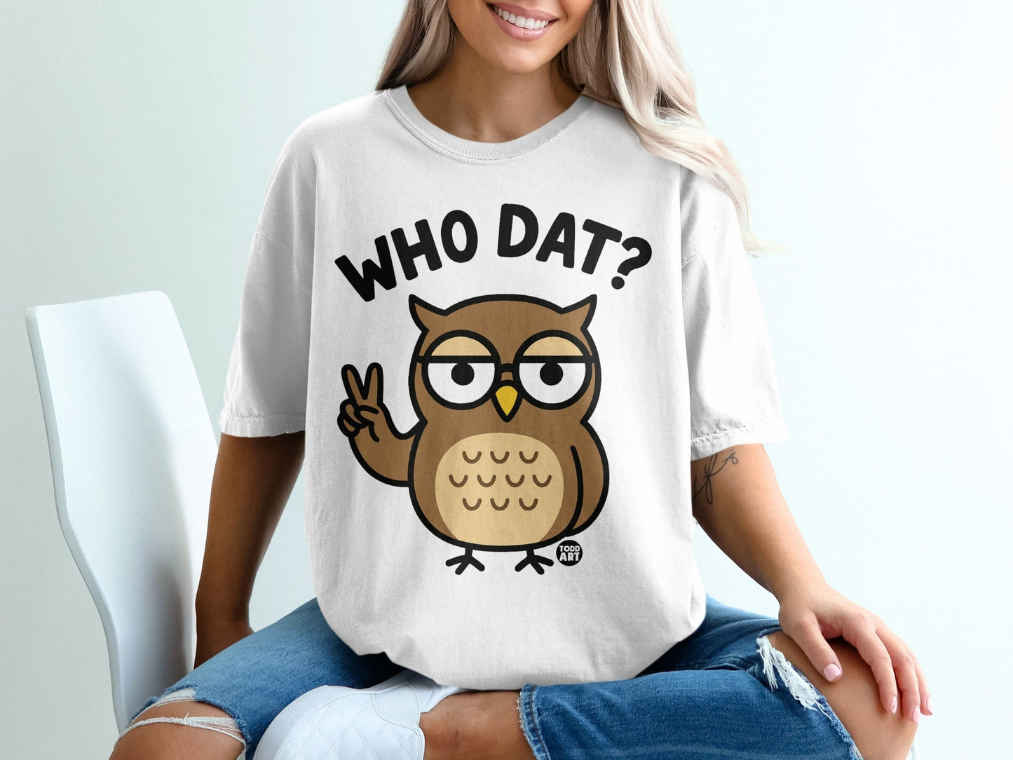 T-shirt with cartoon owl asking "Who Dat?" and making a peace sign.