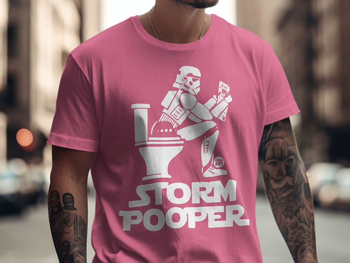 Pink t-shirt with "STORM POOPER" text and Stormtrooper on a toilet.