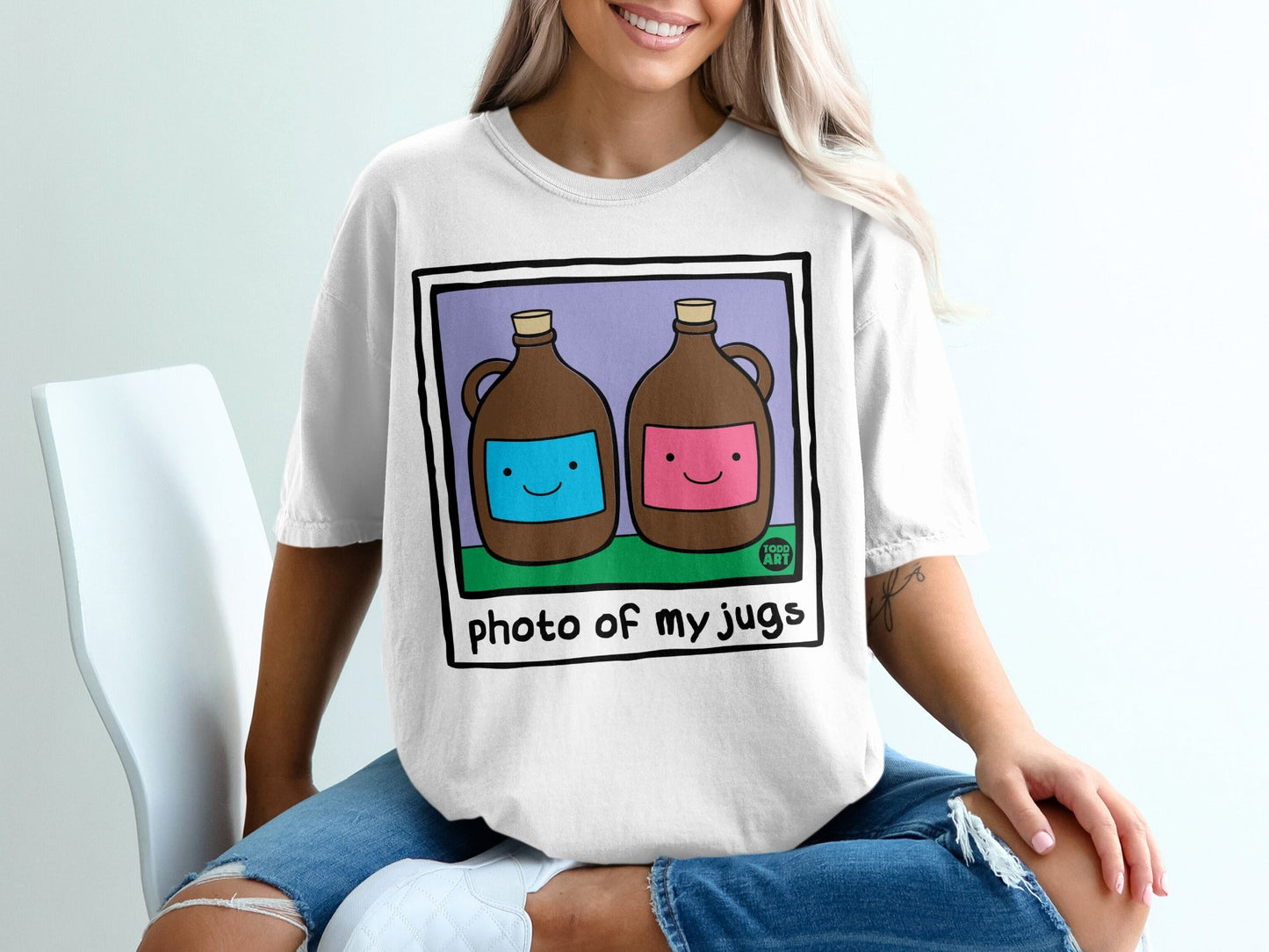 Two cartoon jugs, one blue, one pink, with smiling faces on a white t-shirt.